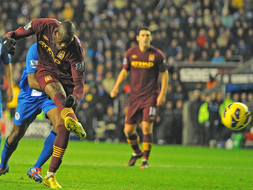 Mario Balotelli opens the scoring for Manchester City