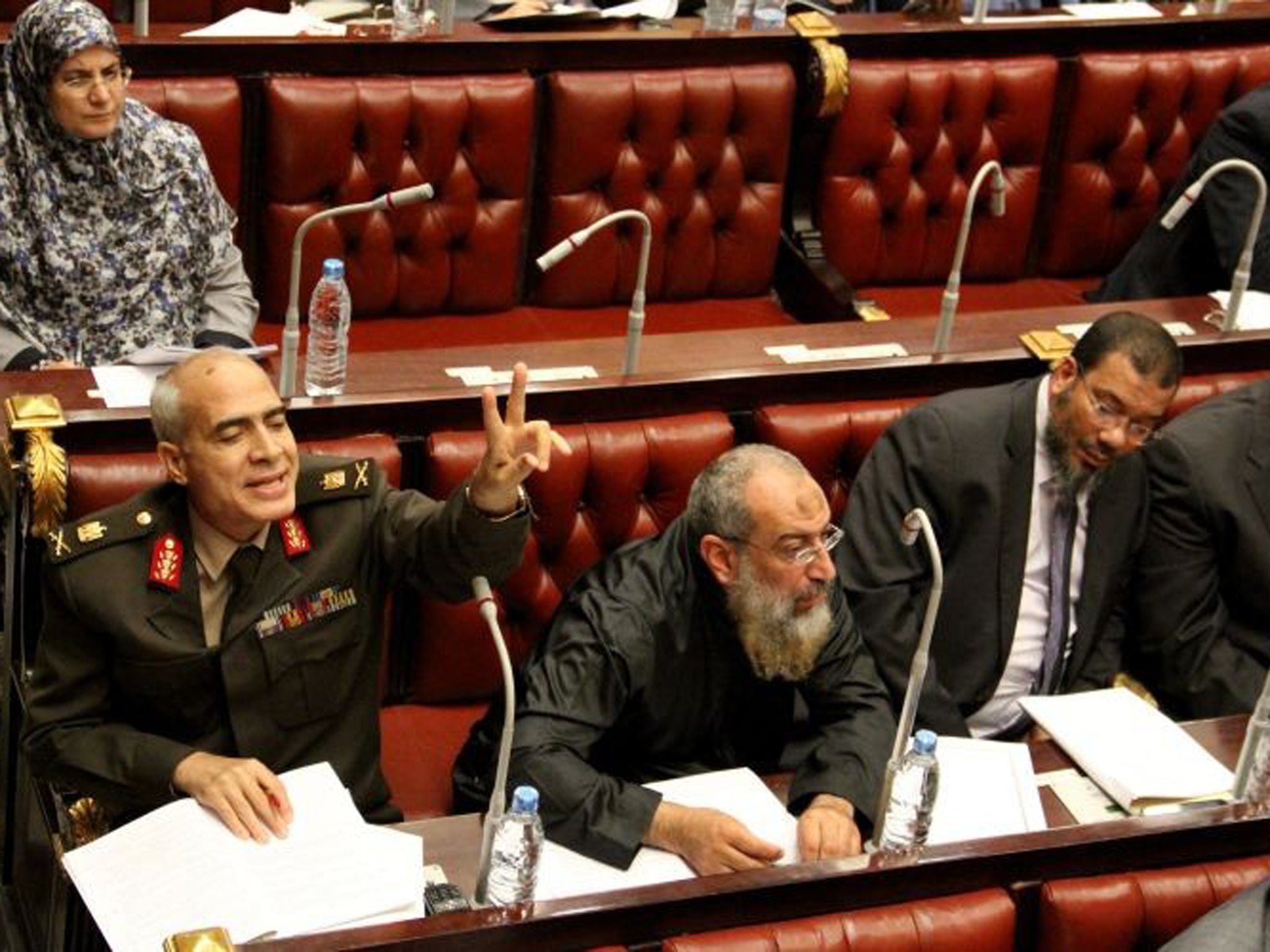 Members of the constitutional assembly attend a session to vote on a final draft of a new Egyptian constitution in Cairo