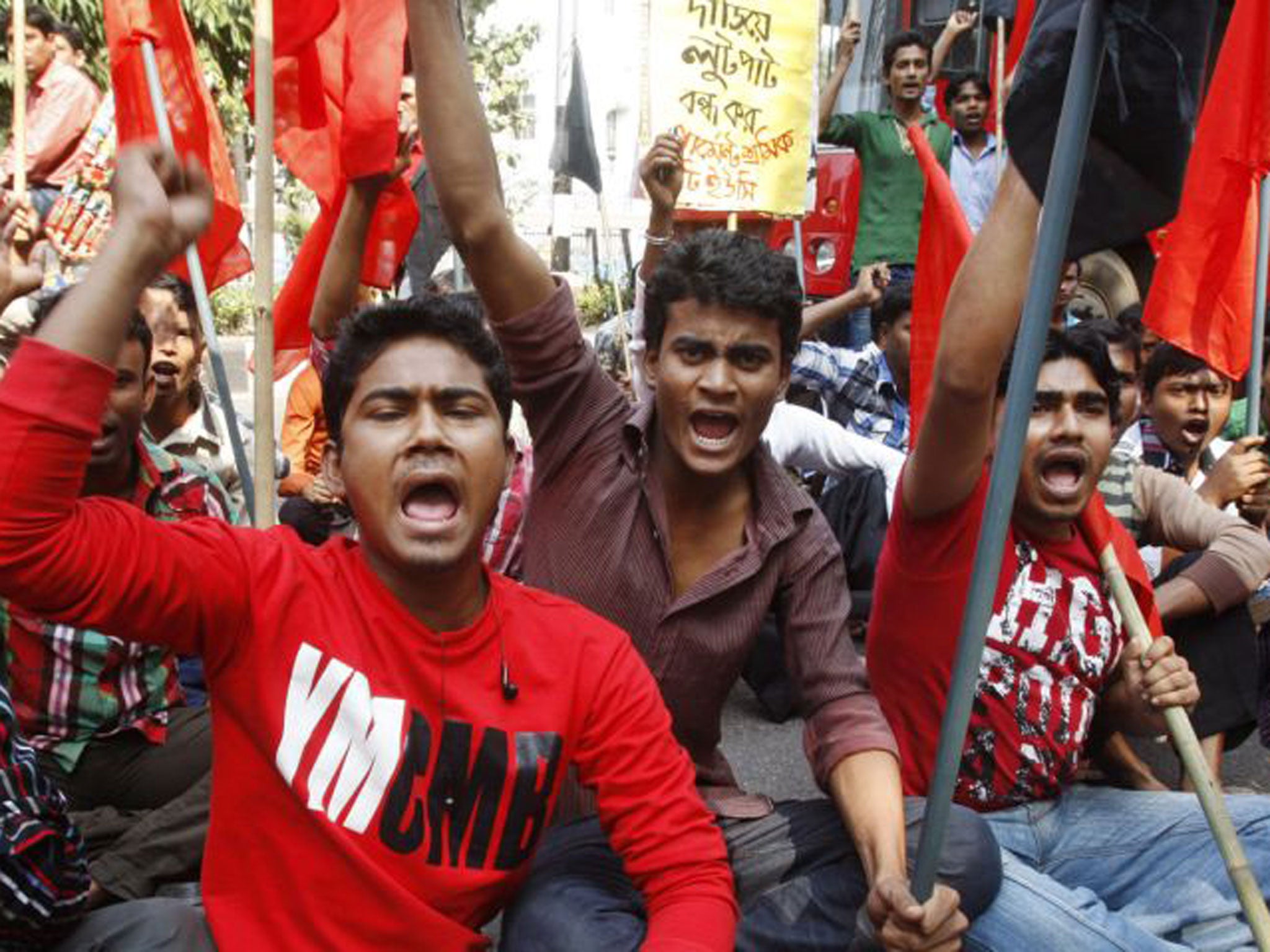 Bangladeshi garment workers from the Tazreen factory demand compensation for their lost salaries