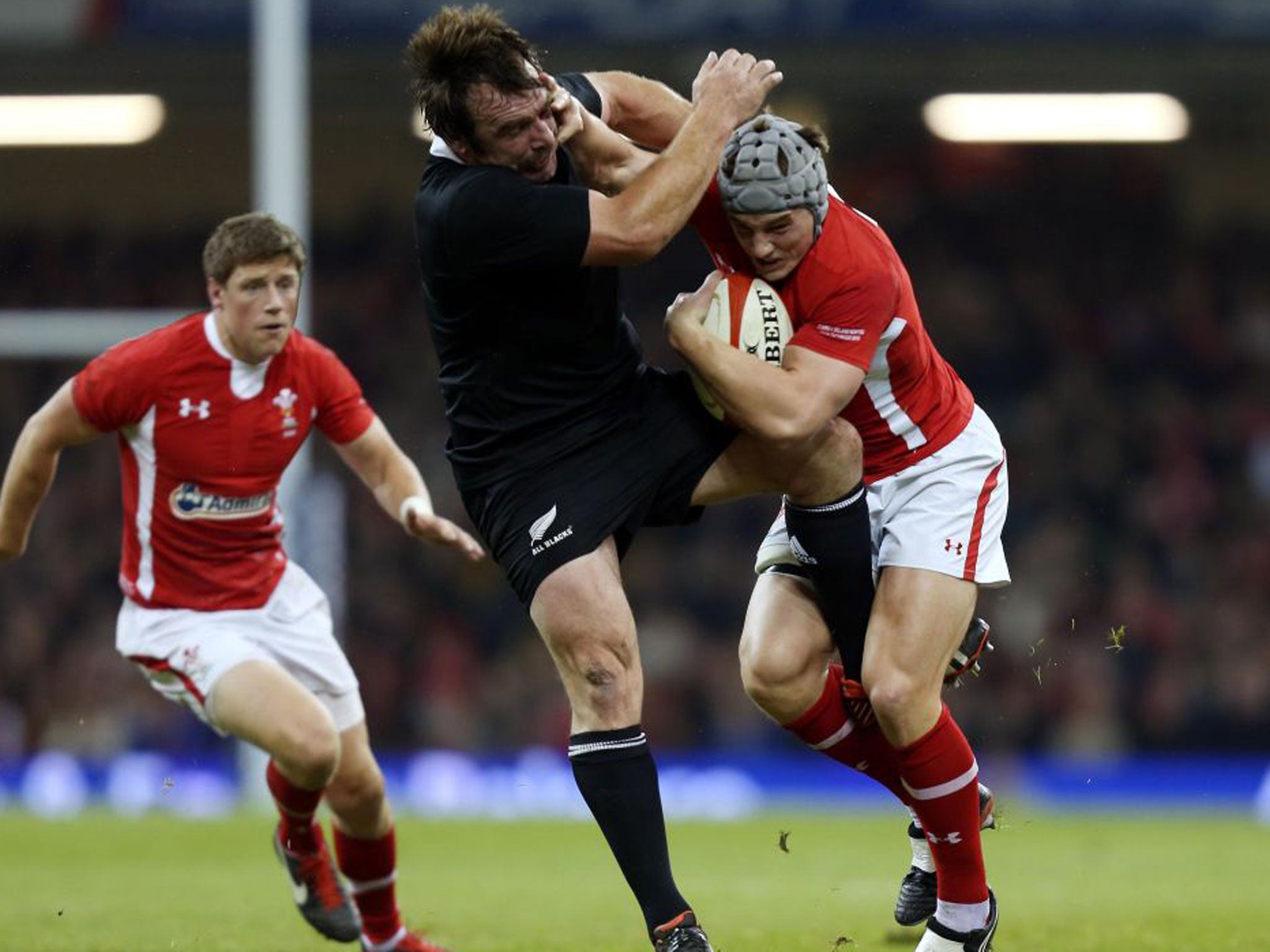 Wales’ Jonathan Davies hands off New Zealand’s Andrew Hore last Saturday