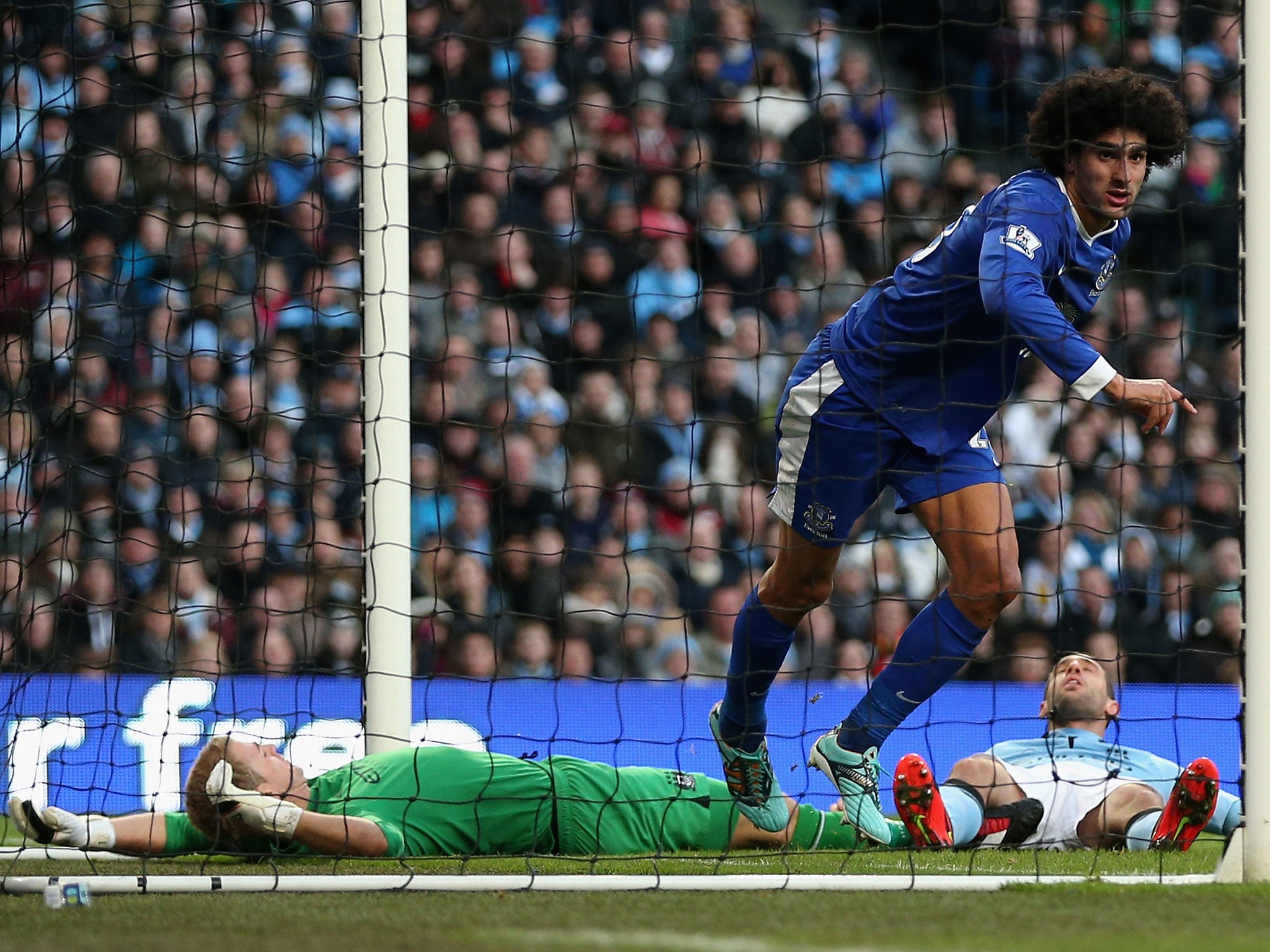 Maraoune Fellaini celebrates after scoring his goal against Manchester City