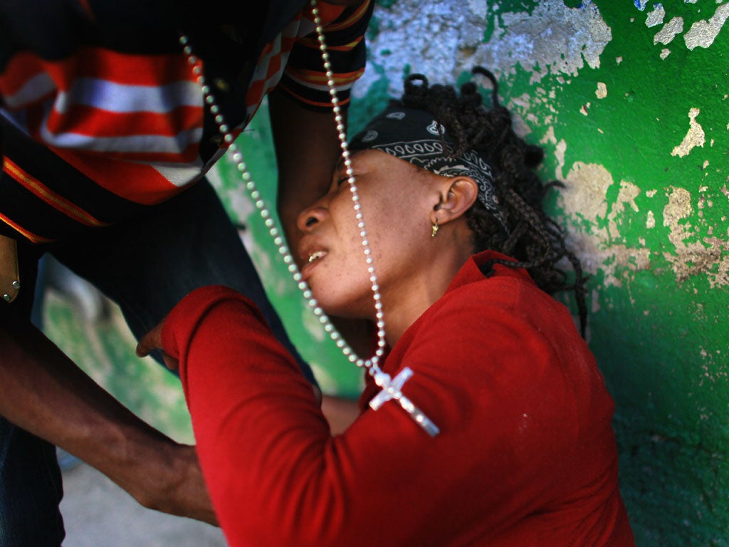 A woman with cholera arrives at a clinic in Port-au-Prince, Haiti in 2012