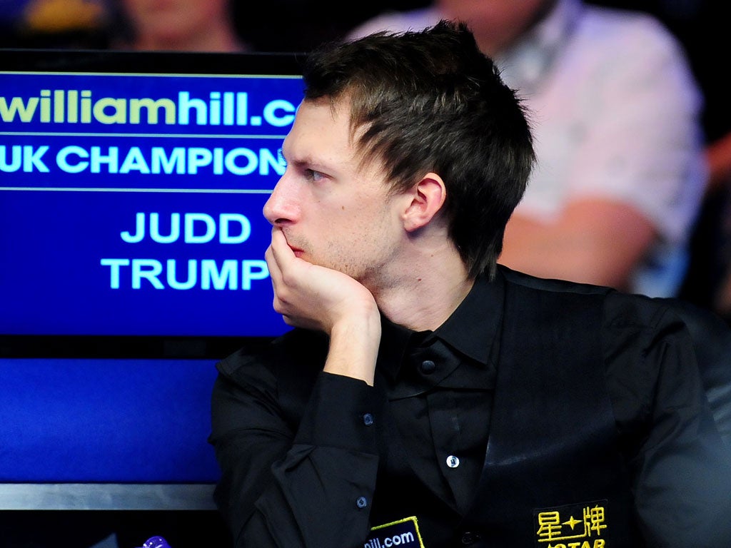 Judd Trump ponders his shock defeat in the UK Championship