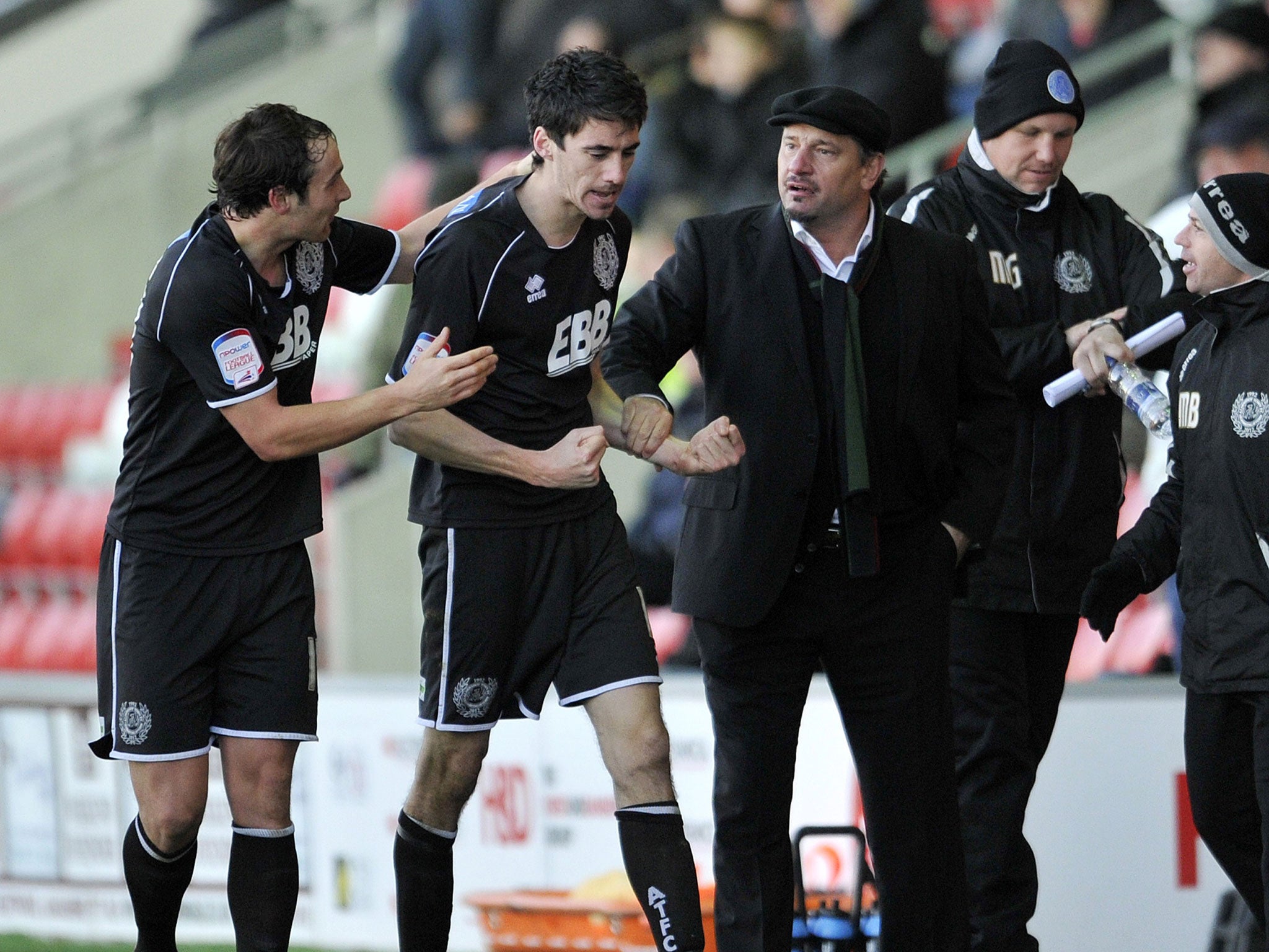 Aldershot manager Dean Holdsworth enjoys an FA Cup win