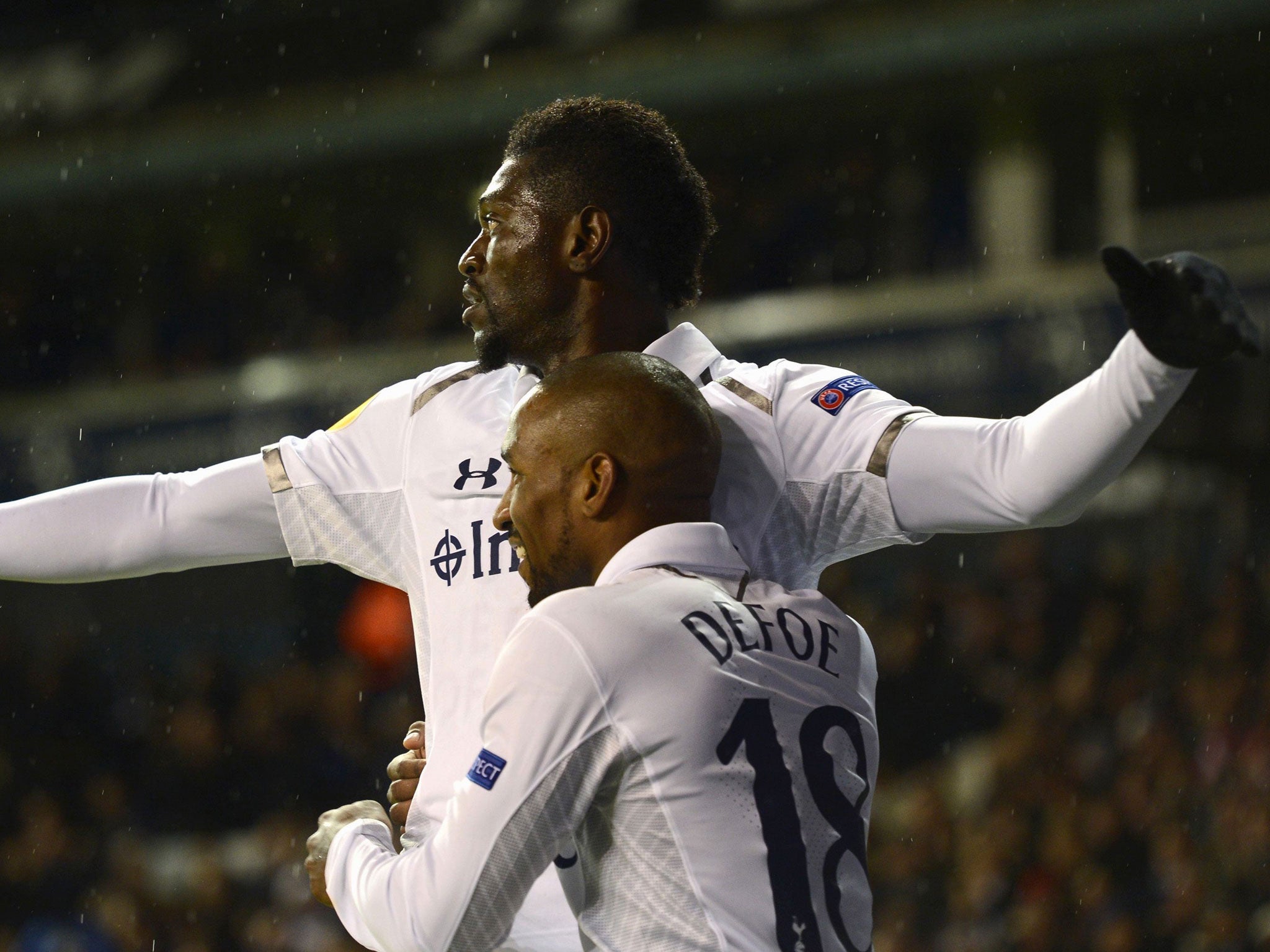 Emmanuel Adebayor celebrates with teammate Jermain Defoe after scoring a goal against Panathinaikos