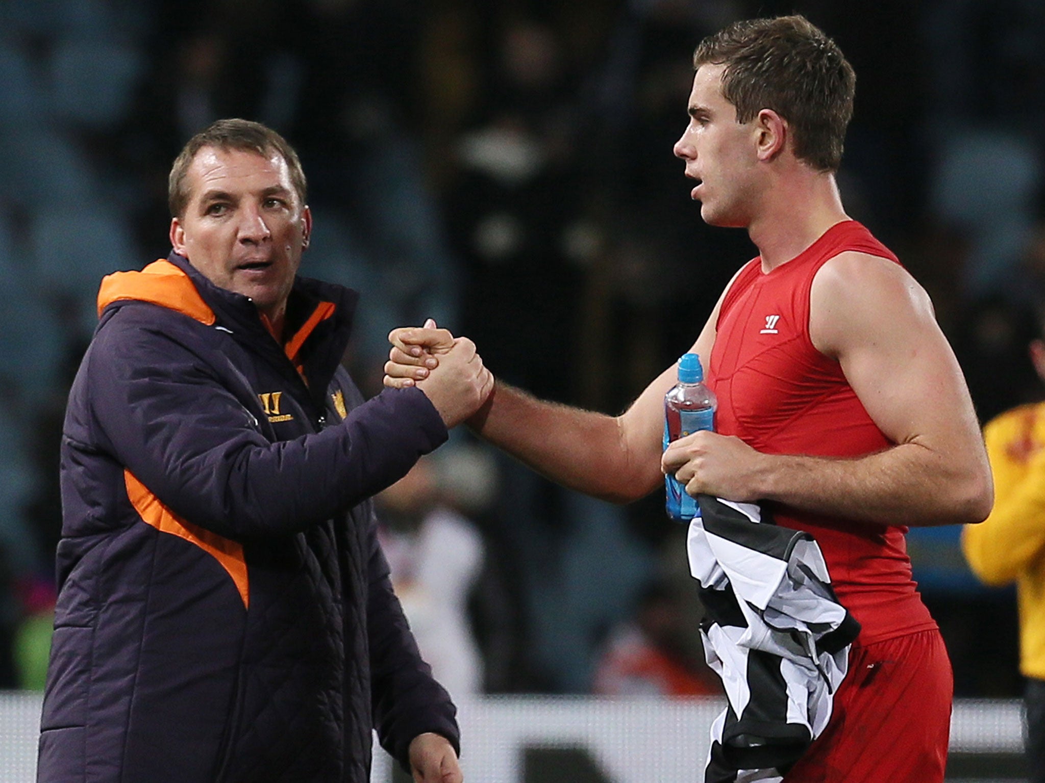 The Liverpool manager, Brendan Rodgers, congratulates Jordan Henderson last night