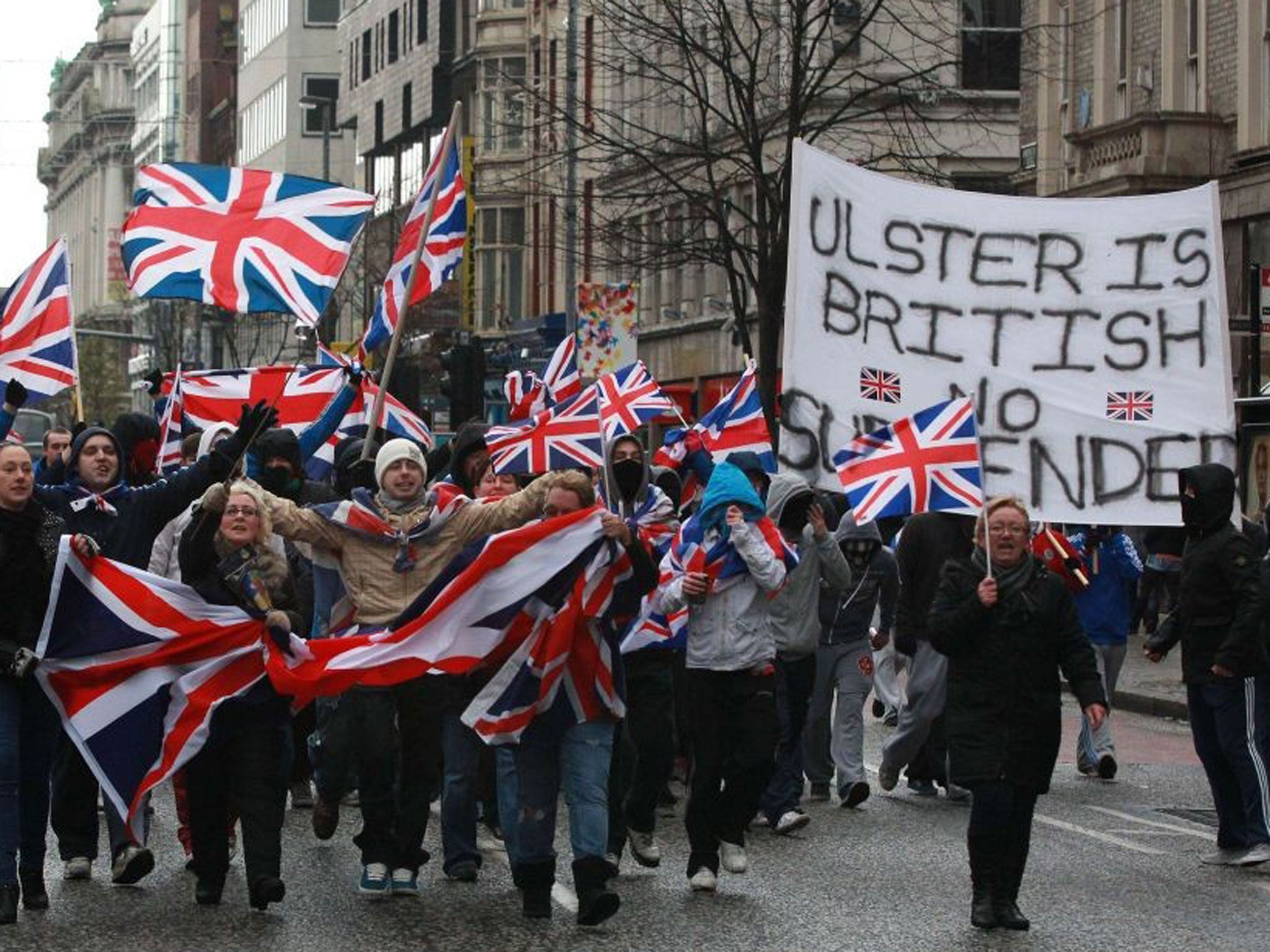 Loyalist march waving British Union Flags in Belfast