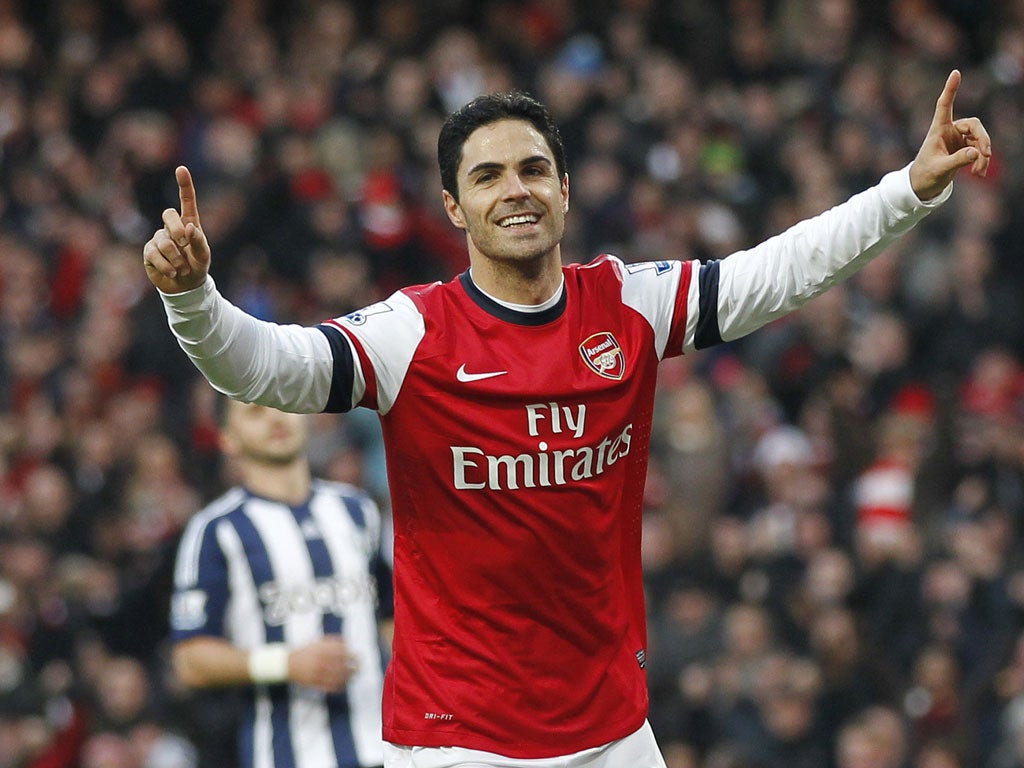 Arsenal's Spanish midfielder Mikel Arteta celebrates after scoring the opening goal from the penalty spot