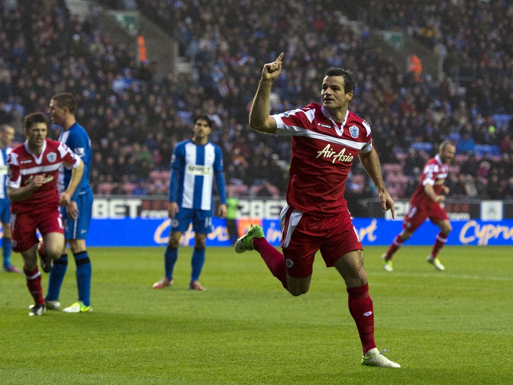 Queens Park Rangers' New Zealand defender Ryan Nelsen (R) celebrates after scoring a goal