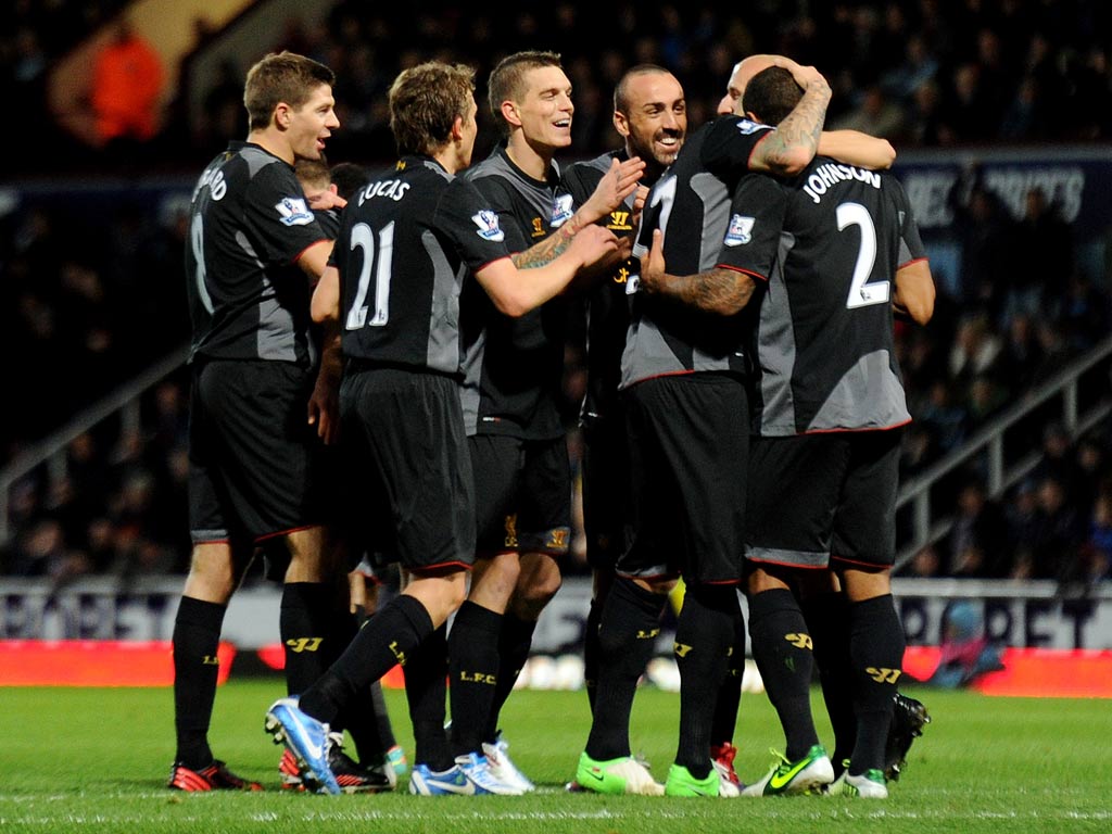Glen Johnson is congratulated by his Liverpool team-mates for his goal against West Ham