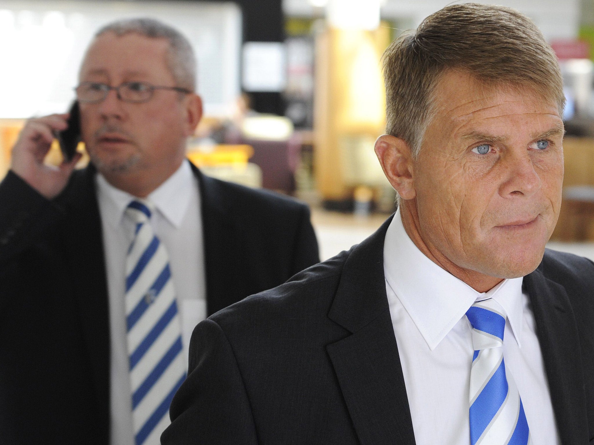 Gillingham chairman Paul Scally and former manager Andy Hessenthaler, arriving at Ashford Employment Tribunal in June