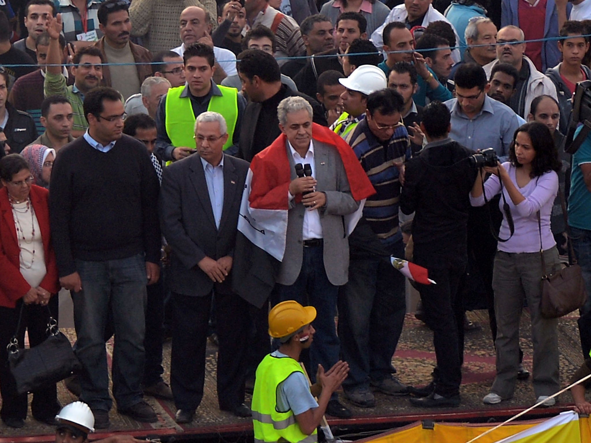 Hamdeen Sabbahy (C), former independent Nasserist candidate in Egypt's presidential elections, gives a speech in Cairo’s landmark Tahrir square on November 30, 2012, as demonstrators stage a sit-in protest against a decree by President Mohamed Morsi grant