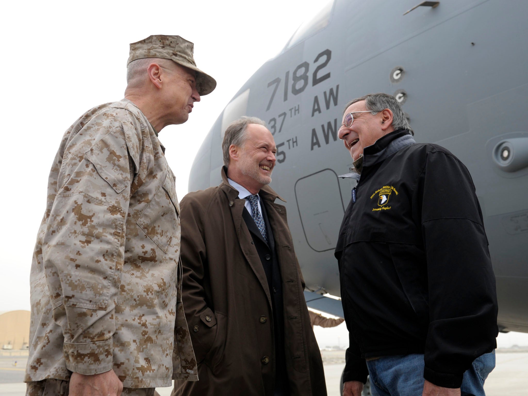 Defense Secretary Leon Panetta (R) talks with U.S. Ambassador to Afghanistan James B. Cunningham, (C), and Marine Gen. John R. Allen, (L), commander of International Security Assistance Force salutes upon his arrival at Kabul International Airport on Dece