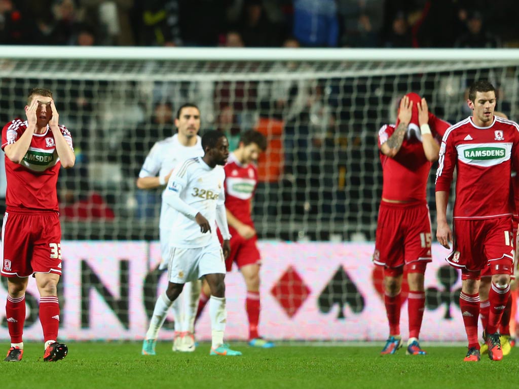 Seb Hines of Middlesbrough holds his head in his hands after scoring an own goal