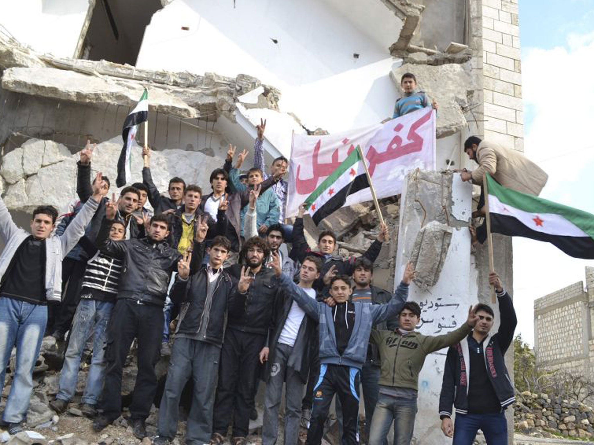 Anti-regime protesters in Idlib province. The rebels appear to be gaining more ground from President Assad’s forces