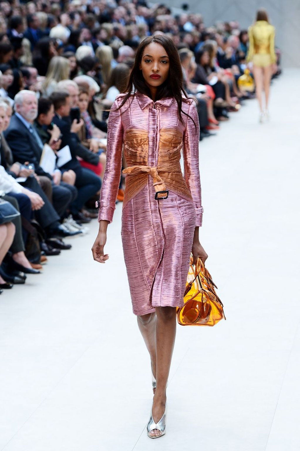 For spring, Burberry's Christopher Bailey dressed models in that fabric, and they shimmered on the catwalk like sweetie wrappers.