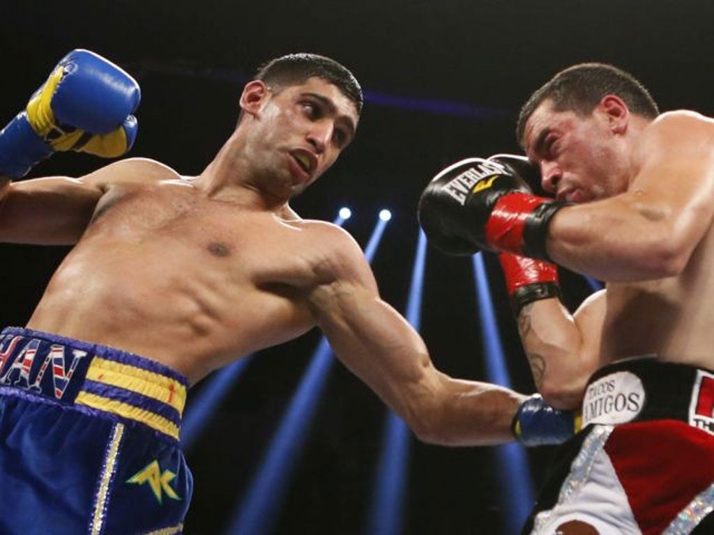 Amir Khan lands a punch on Carlos Molina