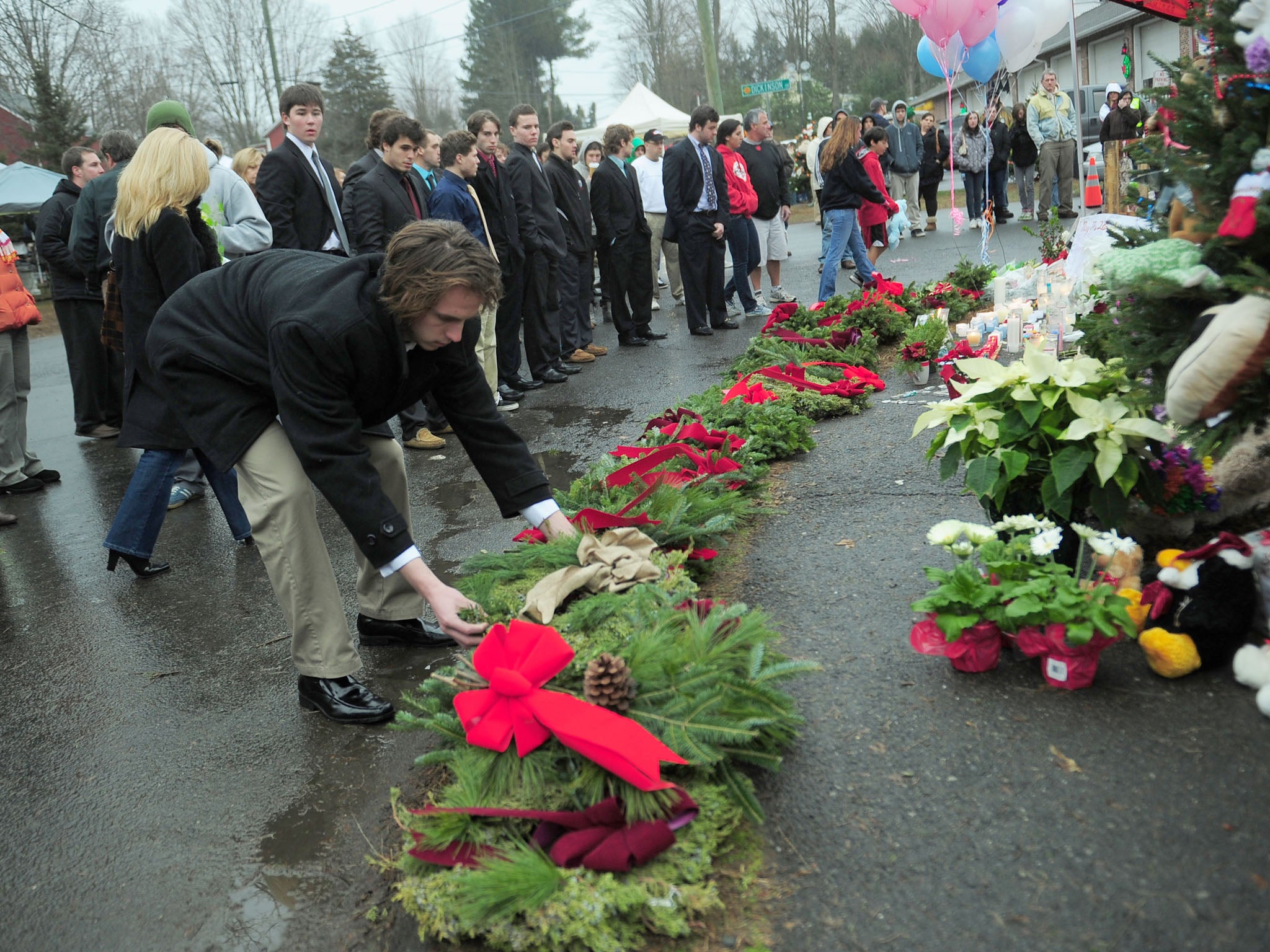 Wreaths are placed at the makeshift shrine at Newtown, Connecticut