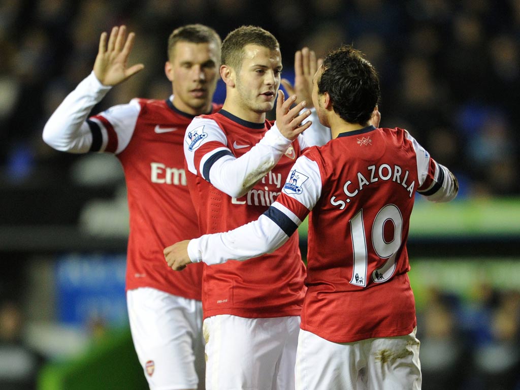 Santi Cazorla is congratulated by Jack Wilshere