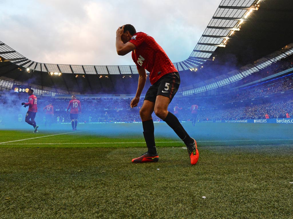 Rio Ferdinand was also hit by a coin in the match