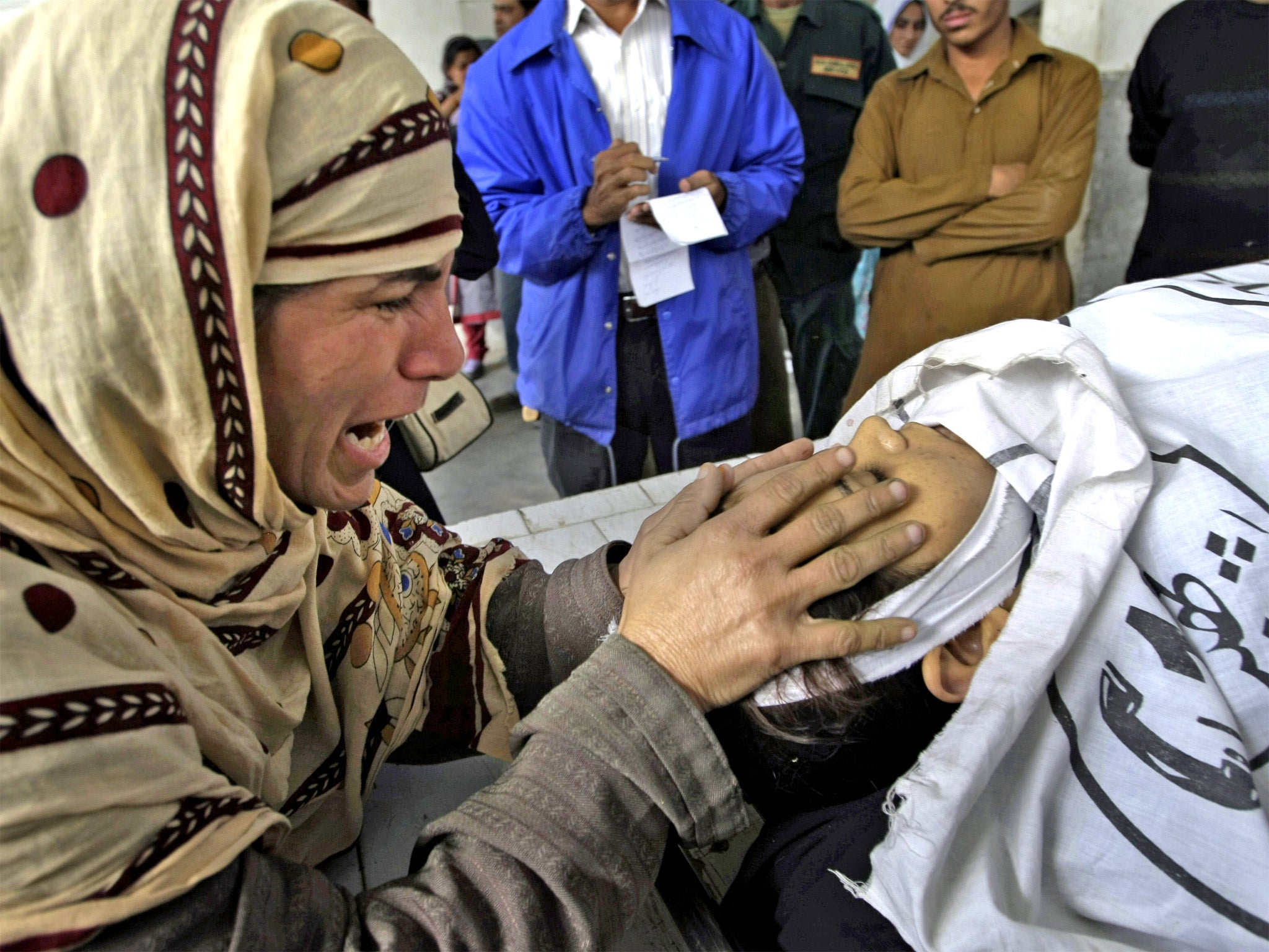 Rukhsana Bibi grieves over her daughter, a health worker, yesterday