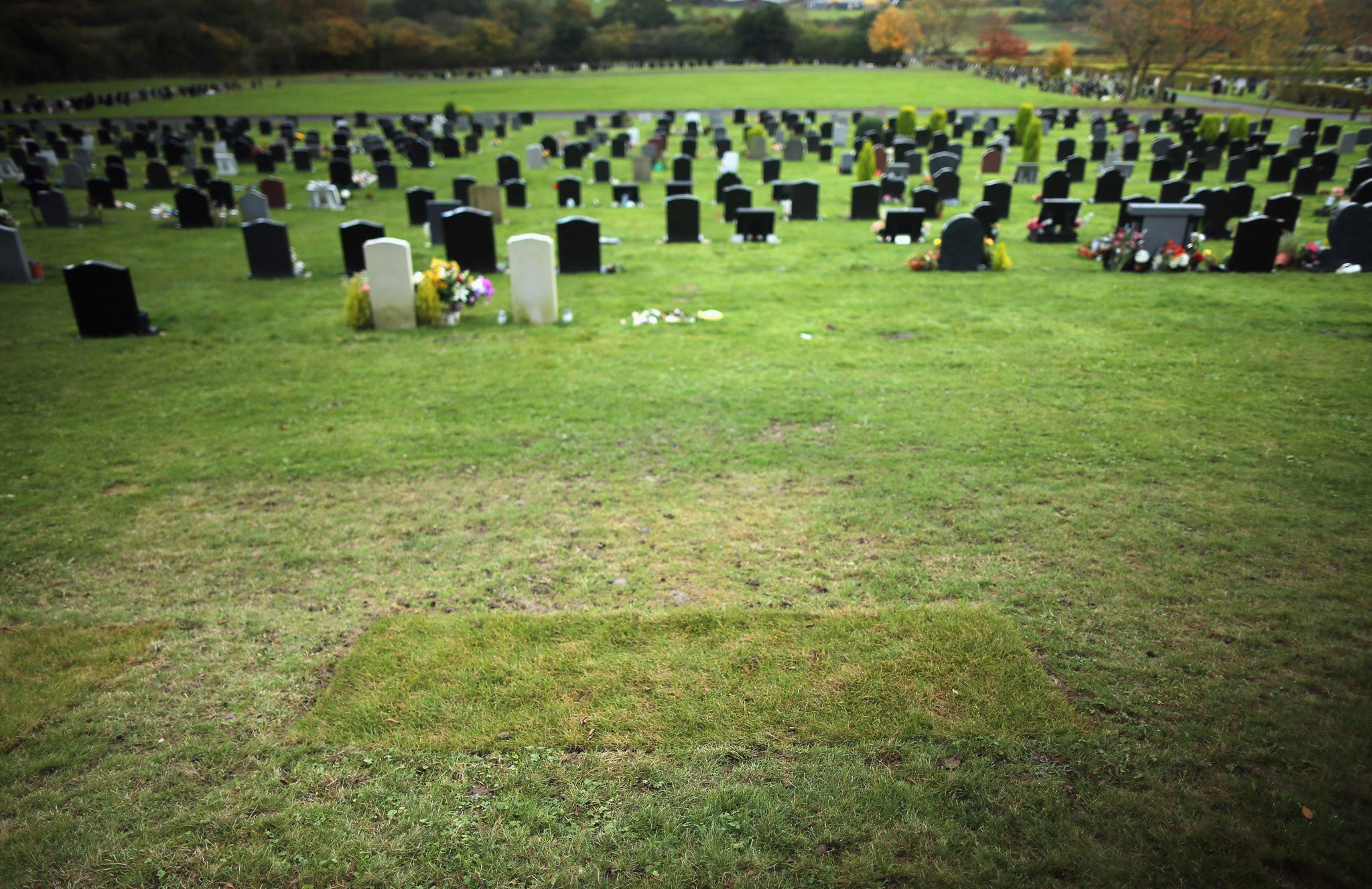 Recently laid turf at the grave of Jimmy Savile after the headstone was removed in October