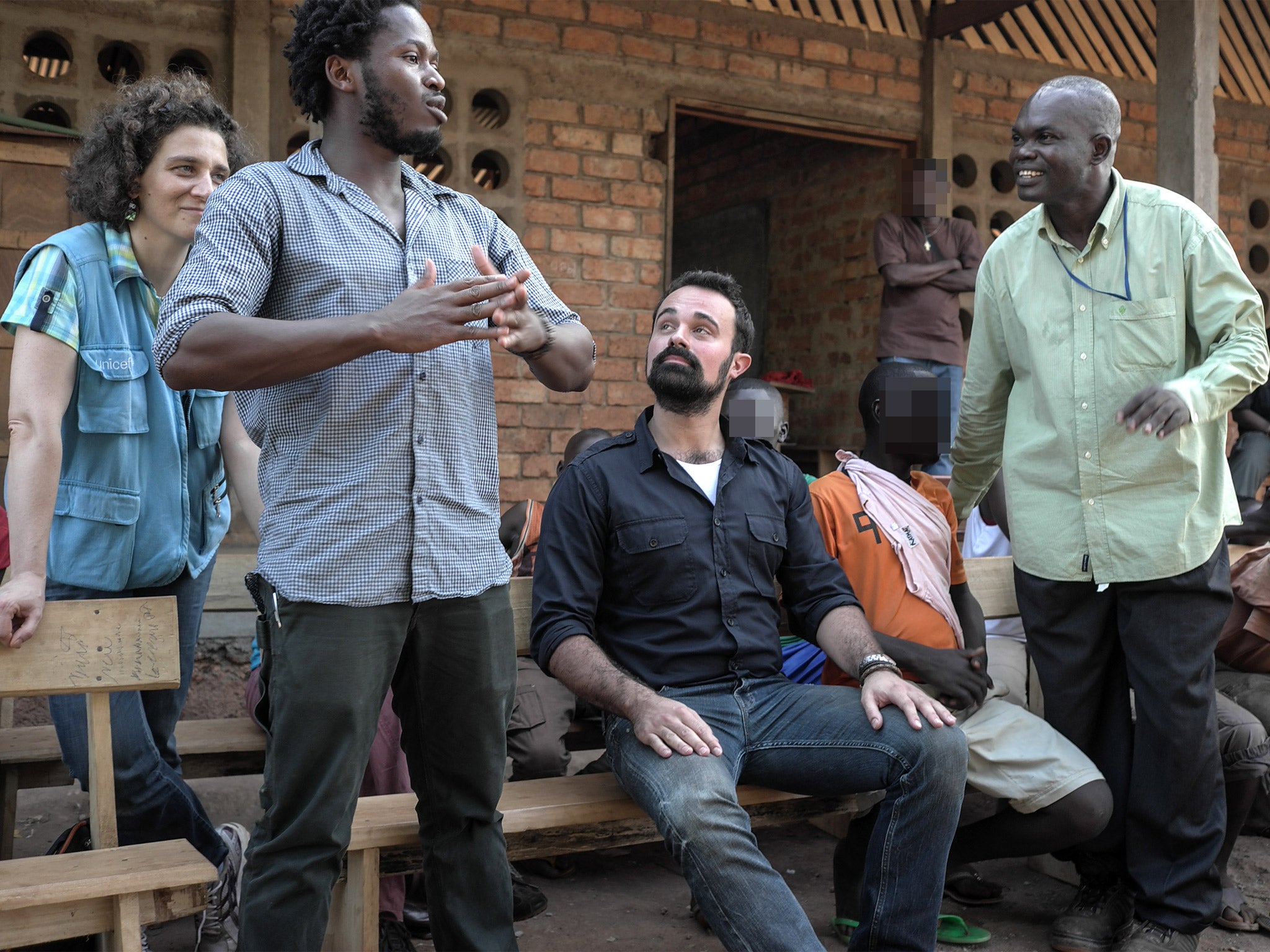 UNICEF Ambassador Ishmael Beah and Evgeny Lebedev speak to children who have been rescued by UNICEF from armed groups and are now receiving support at a transit centre in Bria where they can reclaim their childhoods and rebuild their lives