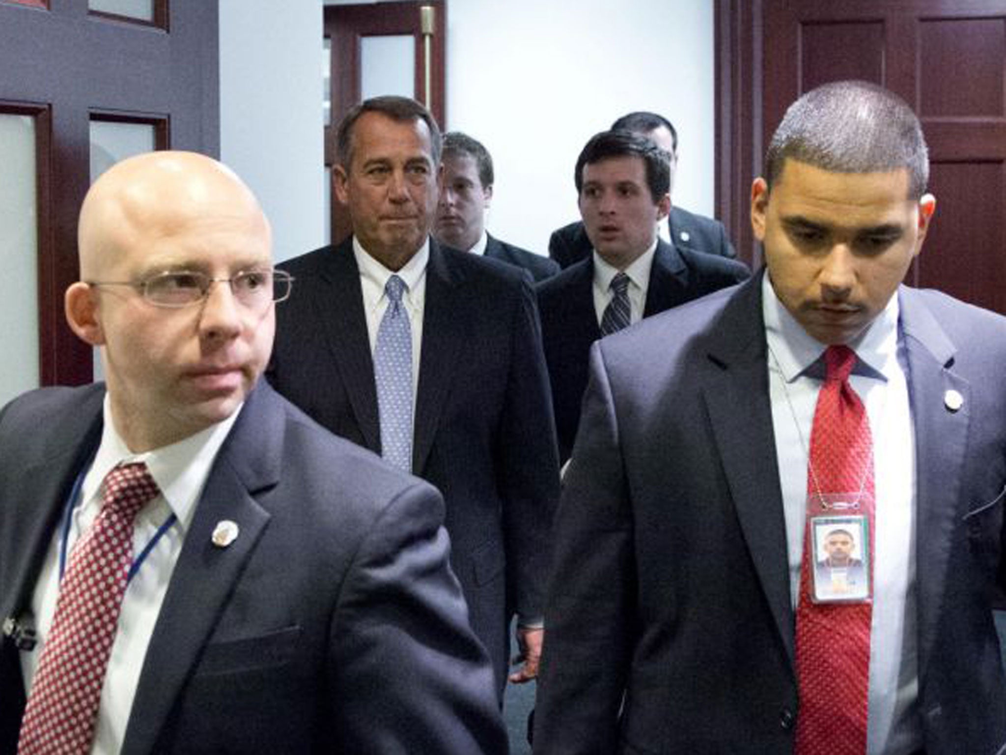 Speaker John Boehner, second from left, departs after a House Republicans meeting on Capitol Hill in Washington