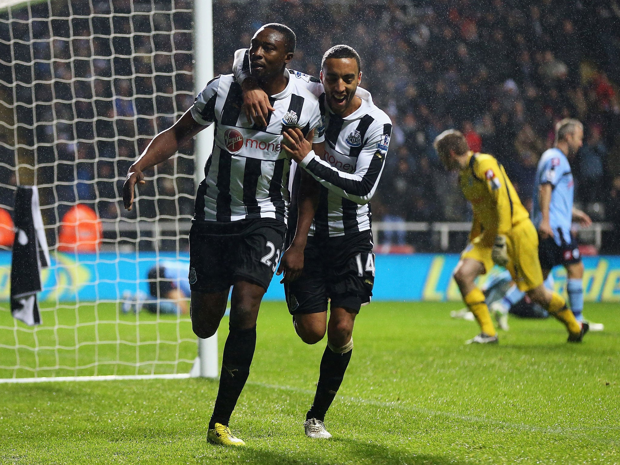 Shola Ameobi of Newcastle celebrates his goal with James Perch