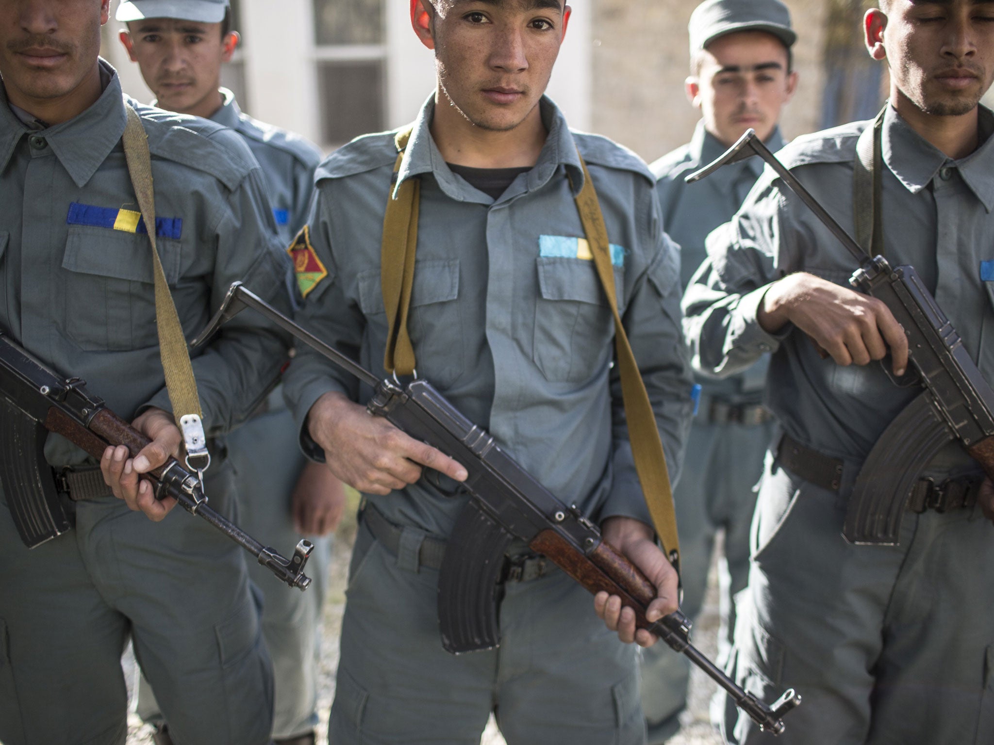 New generation: ANP recruits stand with Kalashnikovs at the Kabul Police Academy last month
