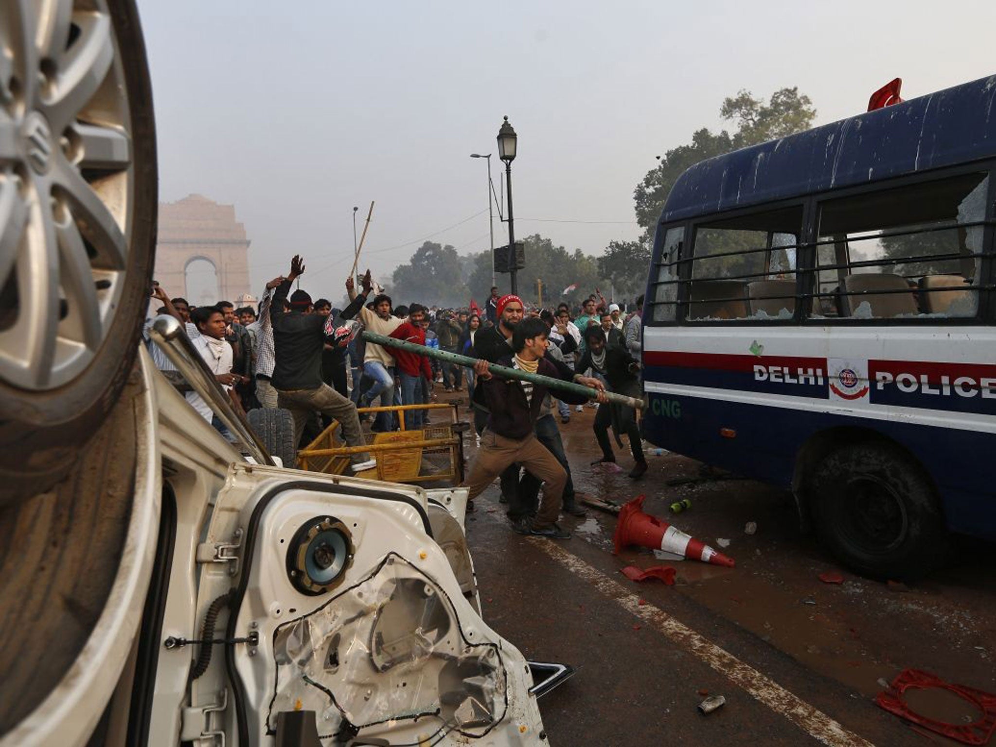 Indian protesters destroy a police van during a violent demonstration near the India Gate against a gang rape and brutal beating of a student on a bus