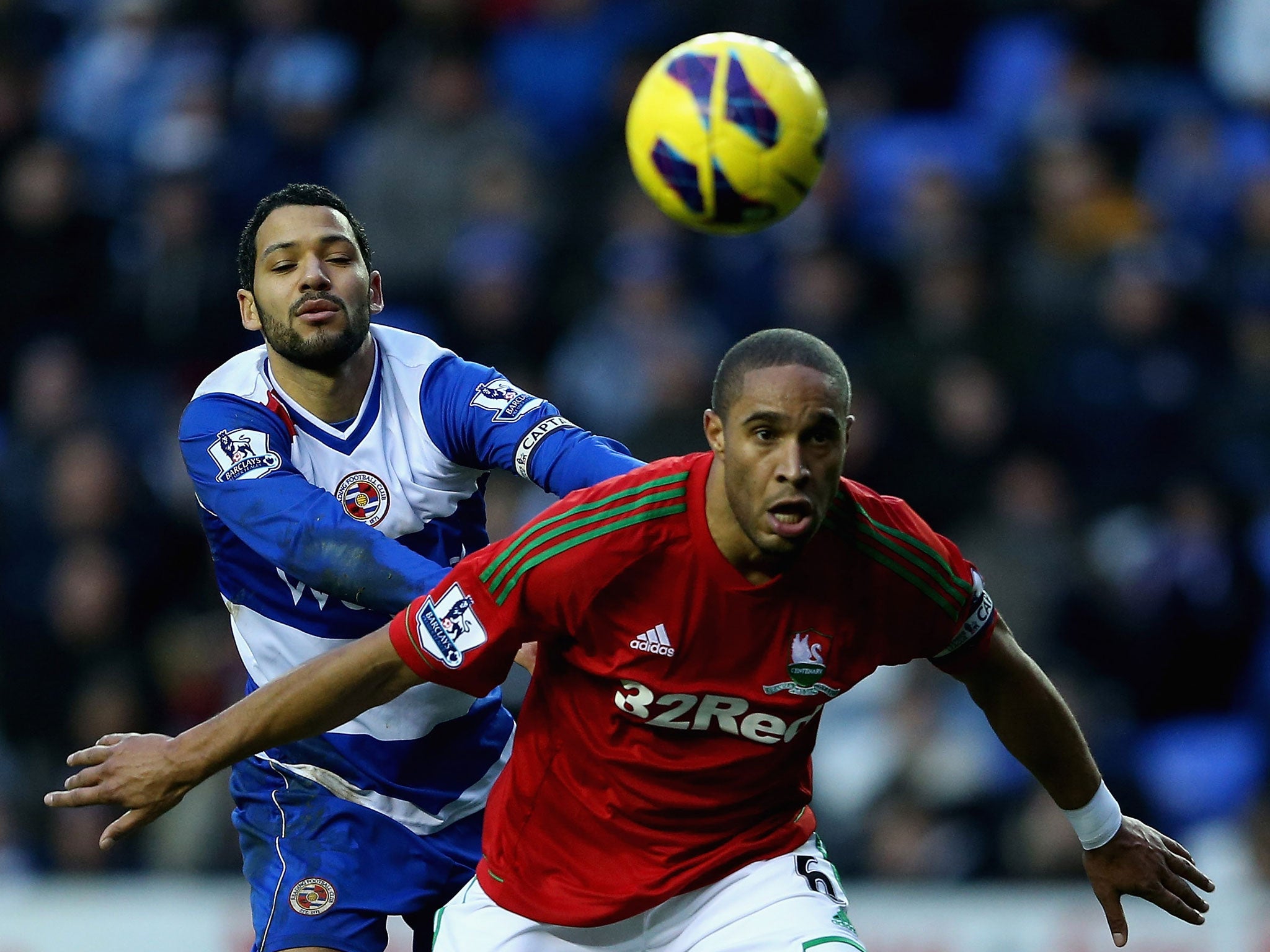 Swansea captain Ashley Williams wins the ball