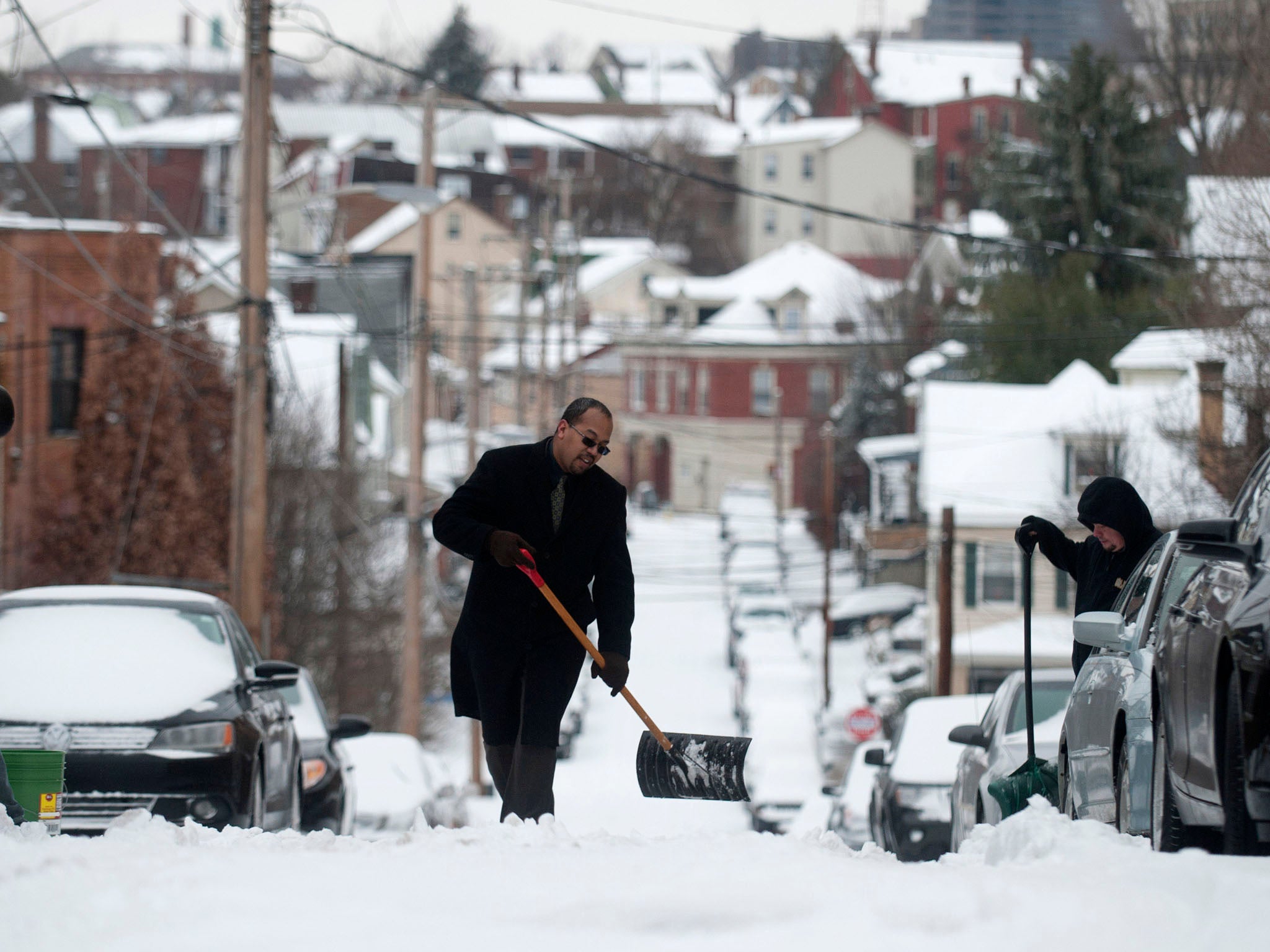 Pittsburgh, Pennsylvania: Residents shovel snow on Mt. Washington after a winter storm blanketed the Midwest with snow December 26, 2012