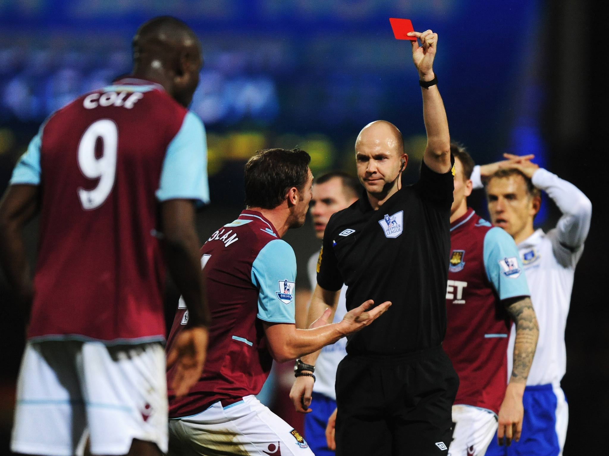 Carlton Cole is shown a red card