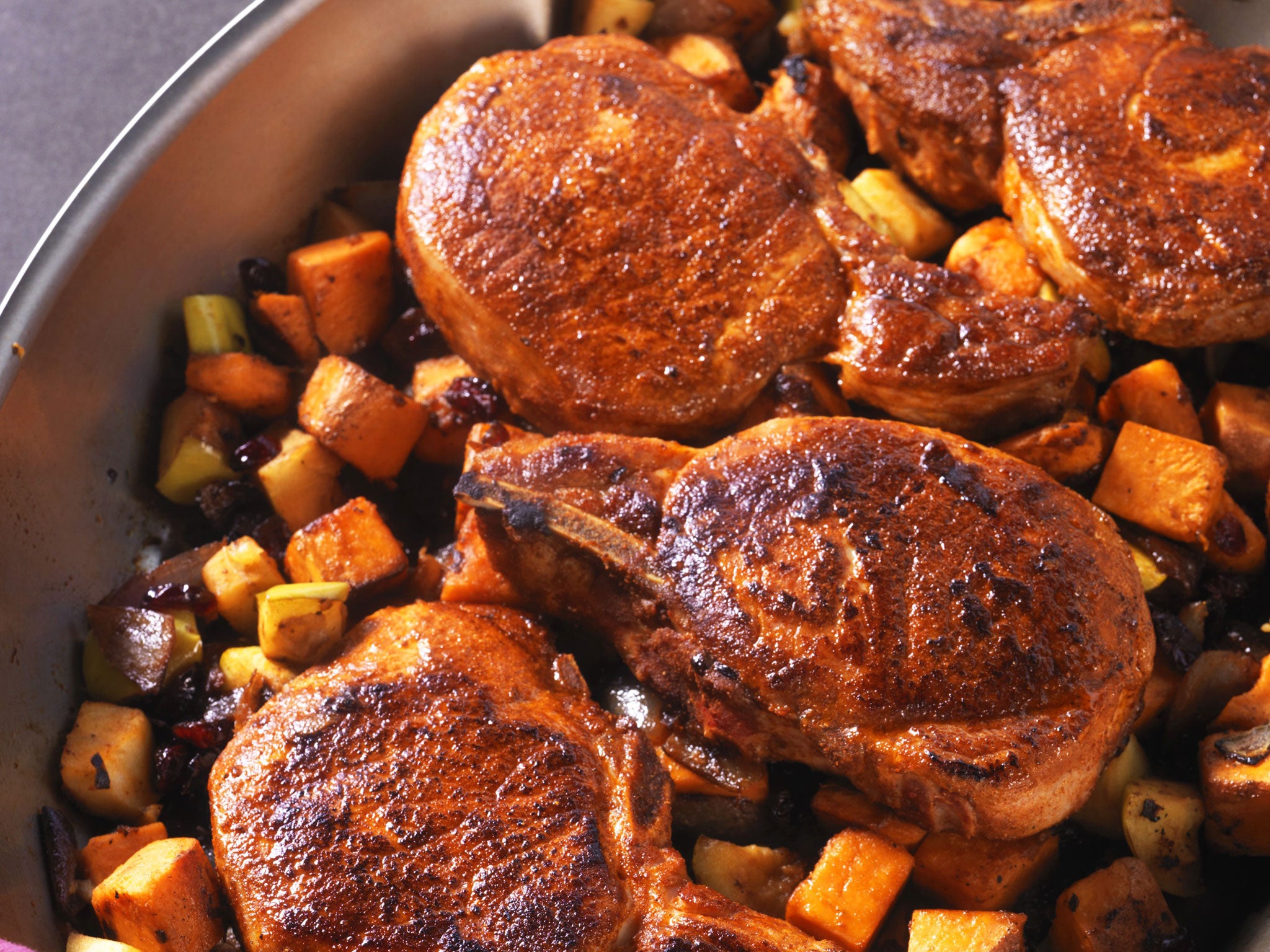 Pork chops with dried cranberry and apple sweet-potato hash