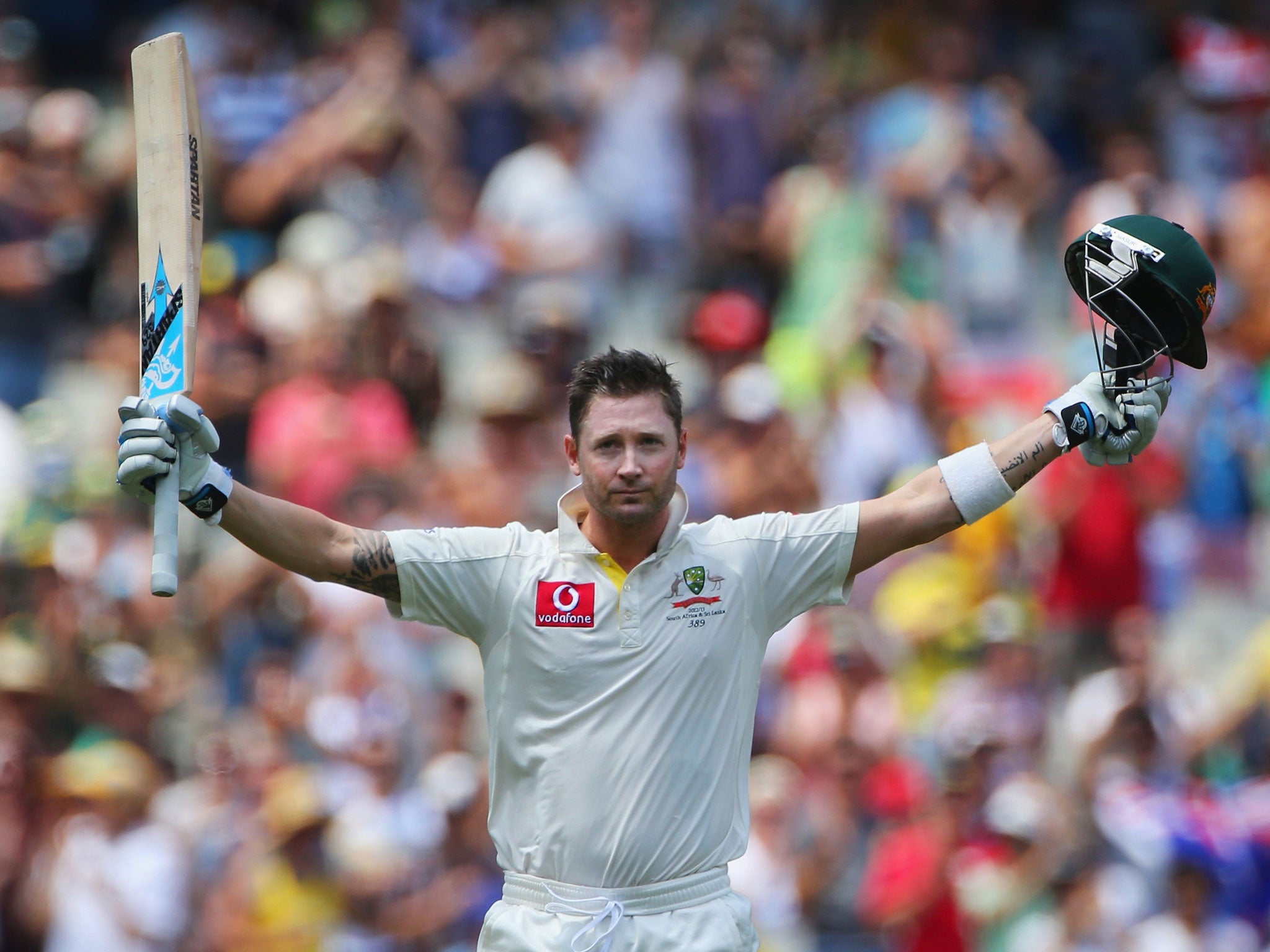 Michael Clarke celebrates reaching his century at the MCG yesterday