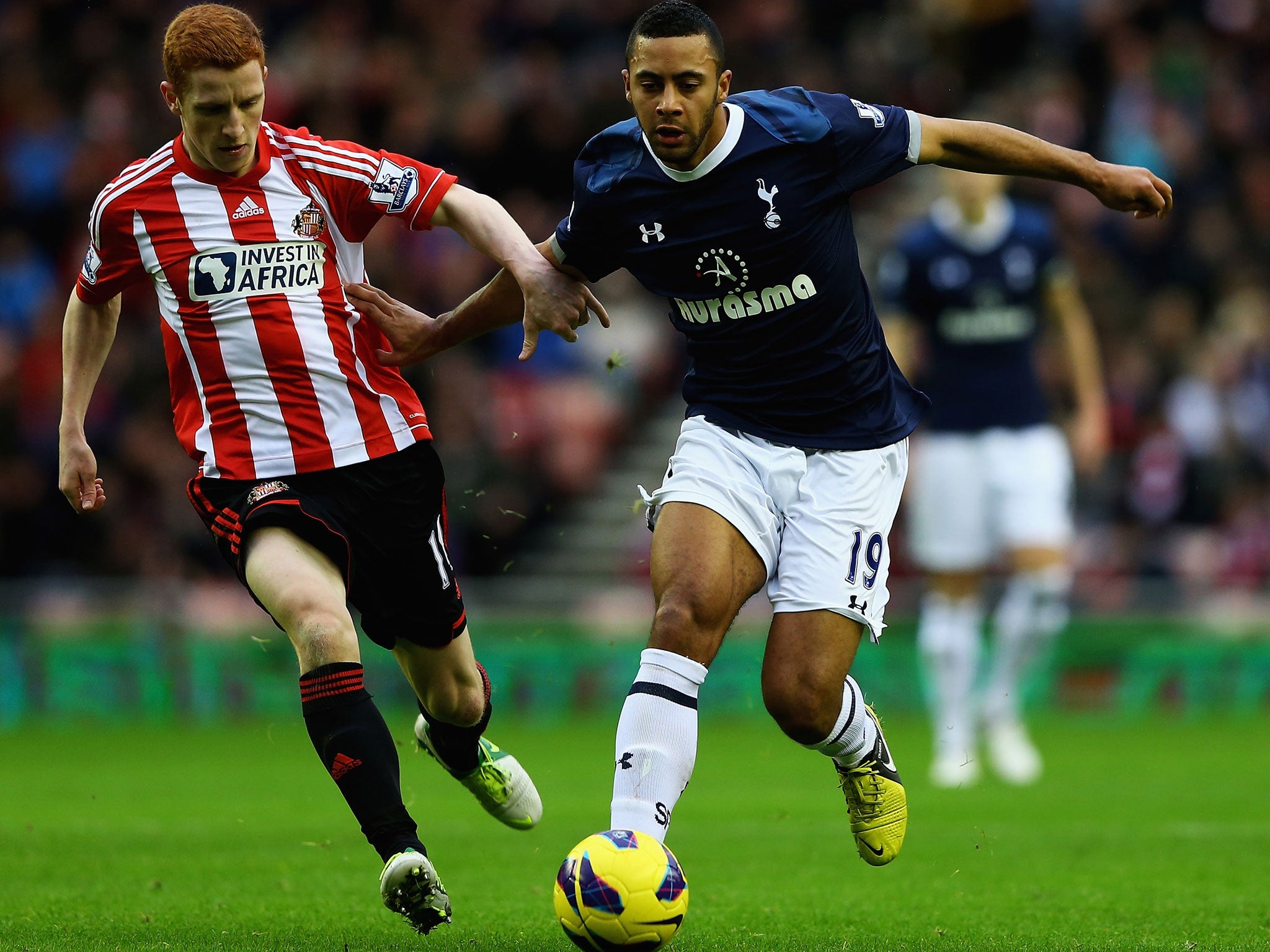 Moussa Dembele (right) holds off Sunderland's Jack Colback