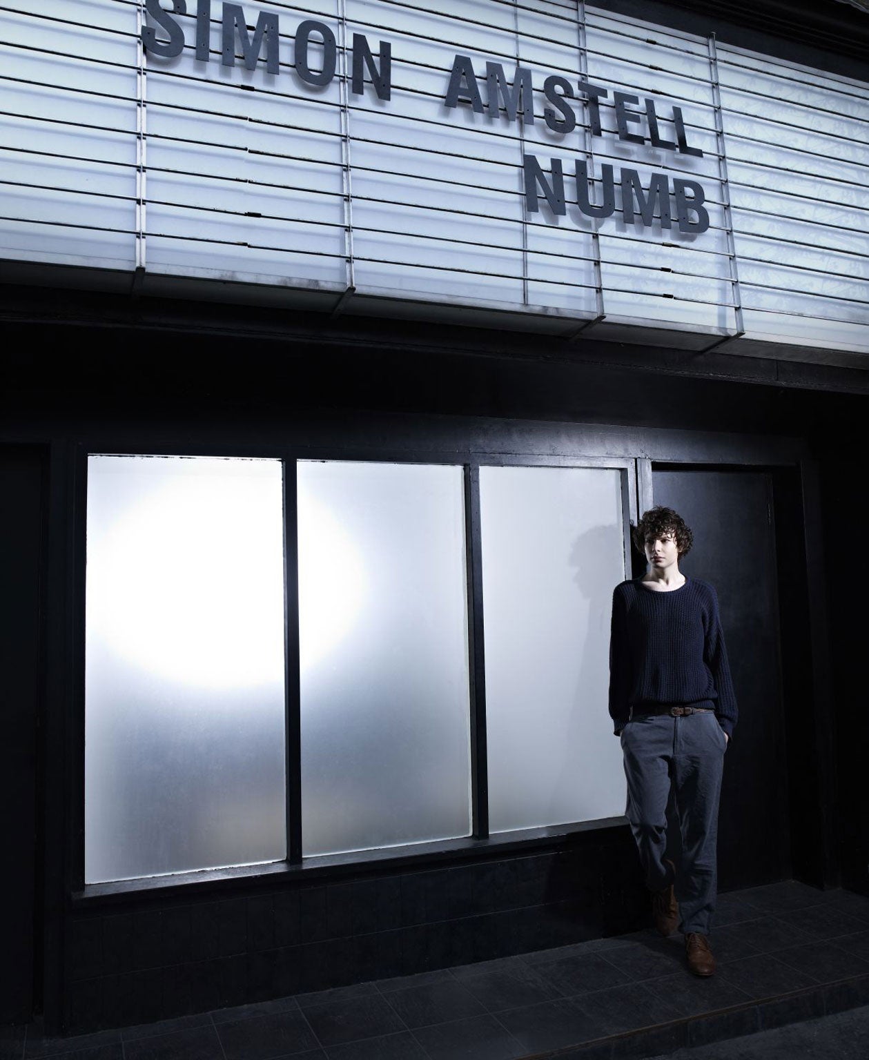Amstell standing outside his latest live show, ‘Numb’