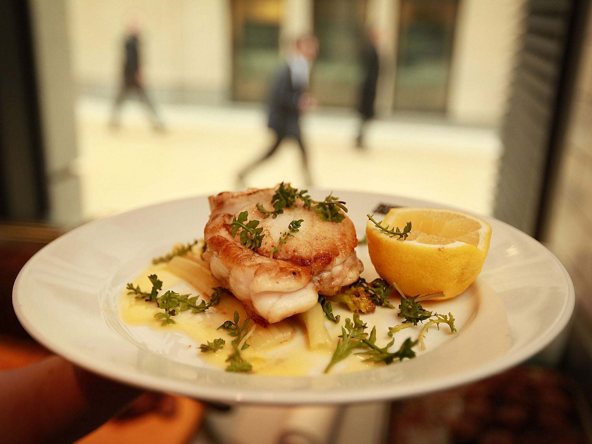 An order of monkfish is prepared for a customer at the Paternoster Chop House restaurant on February 26, 2009 in London.