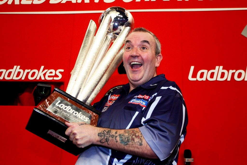 Phil Taylor celebrates winning the 2013 World Darts Championship