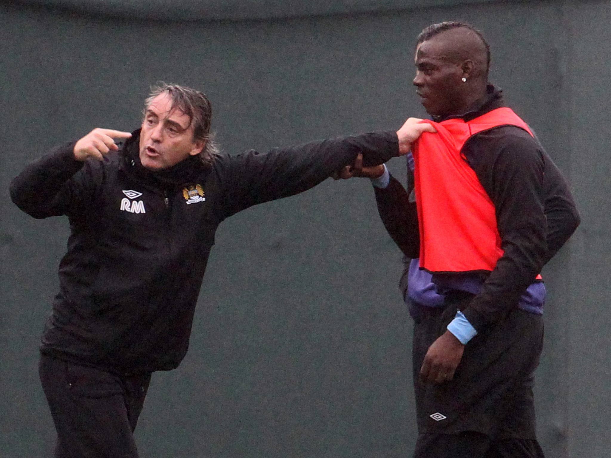 v2Roberto Mancini and Mario Balotelli come together