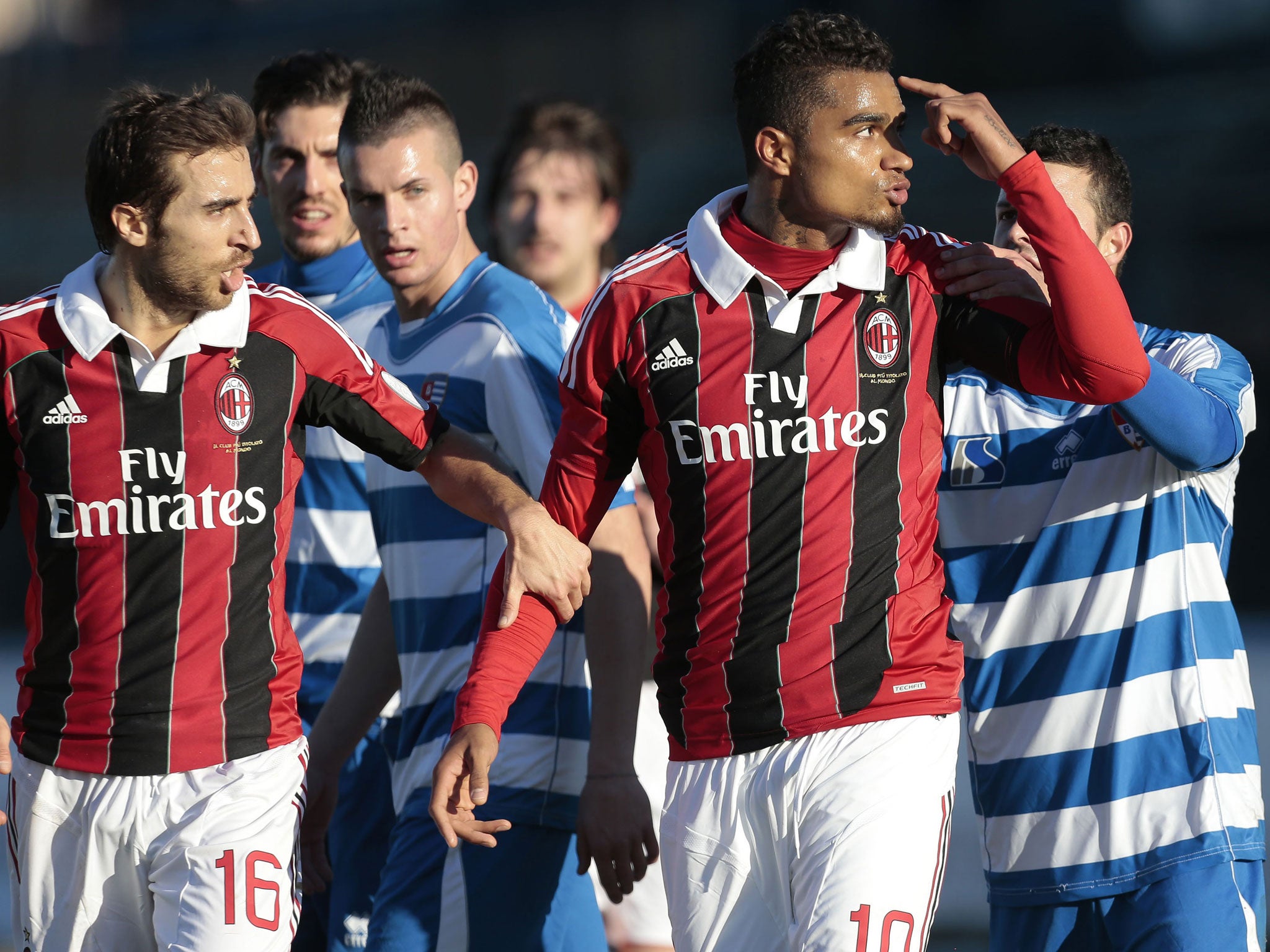 Milan’s Kevin-Prince Boateng gestures towards his abusers