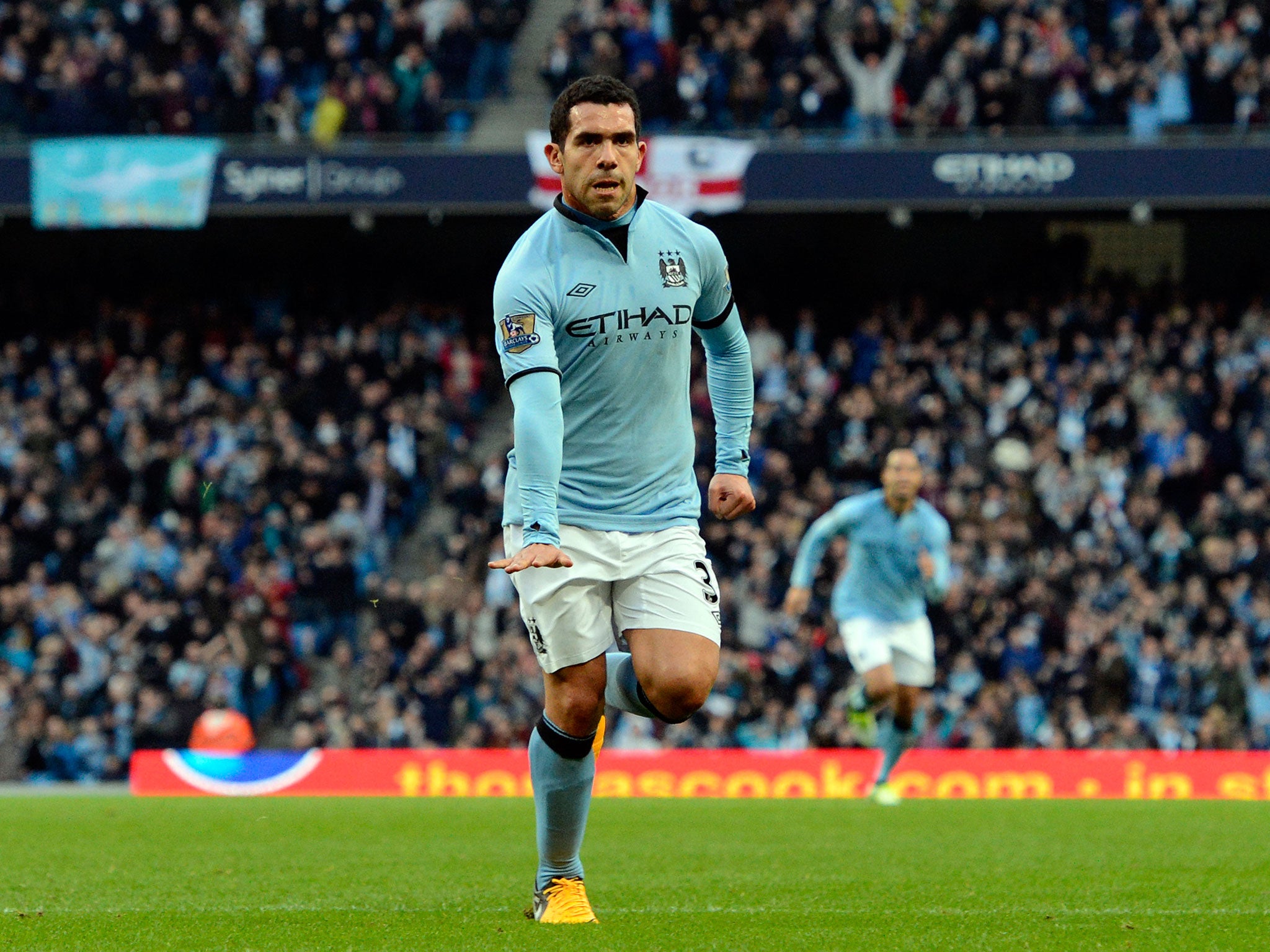 Manchester City's Argentinian striker Carlos Tevez celebrates scoring from a free kick