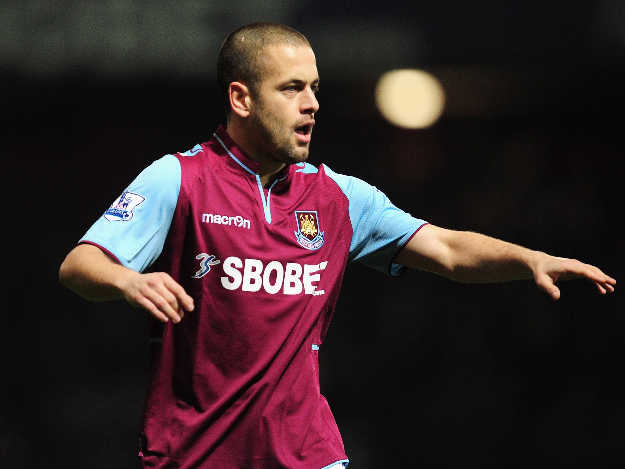 Joe Cole of West Ham United looks on