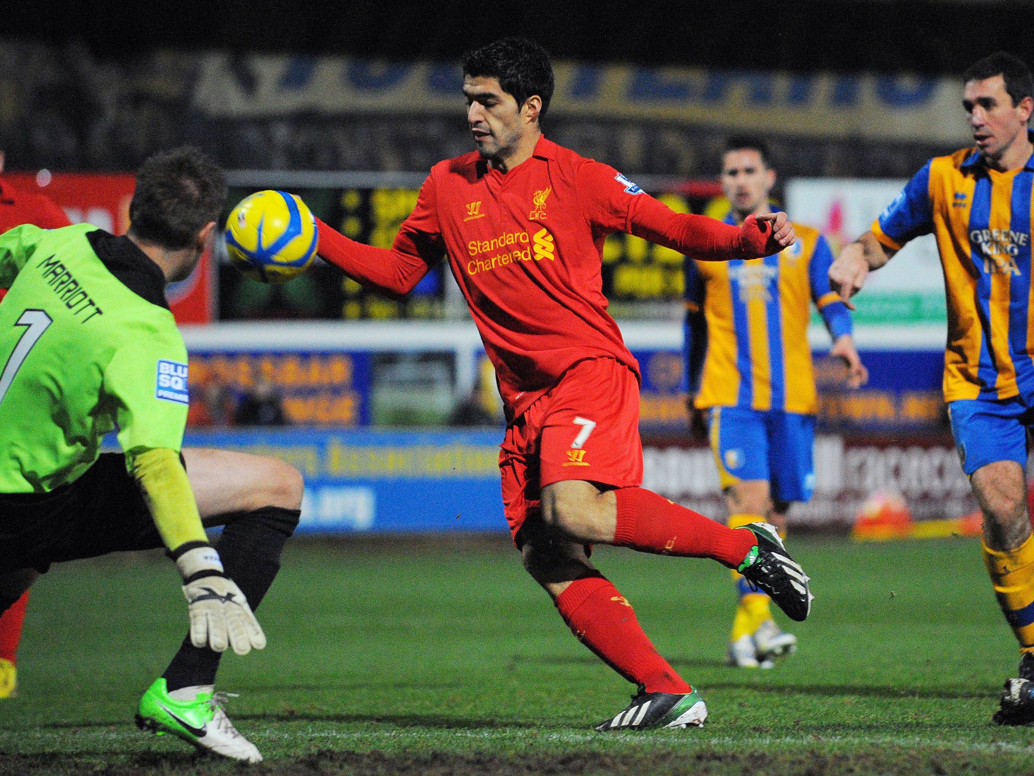 Luis Suarez handles the ball