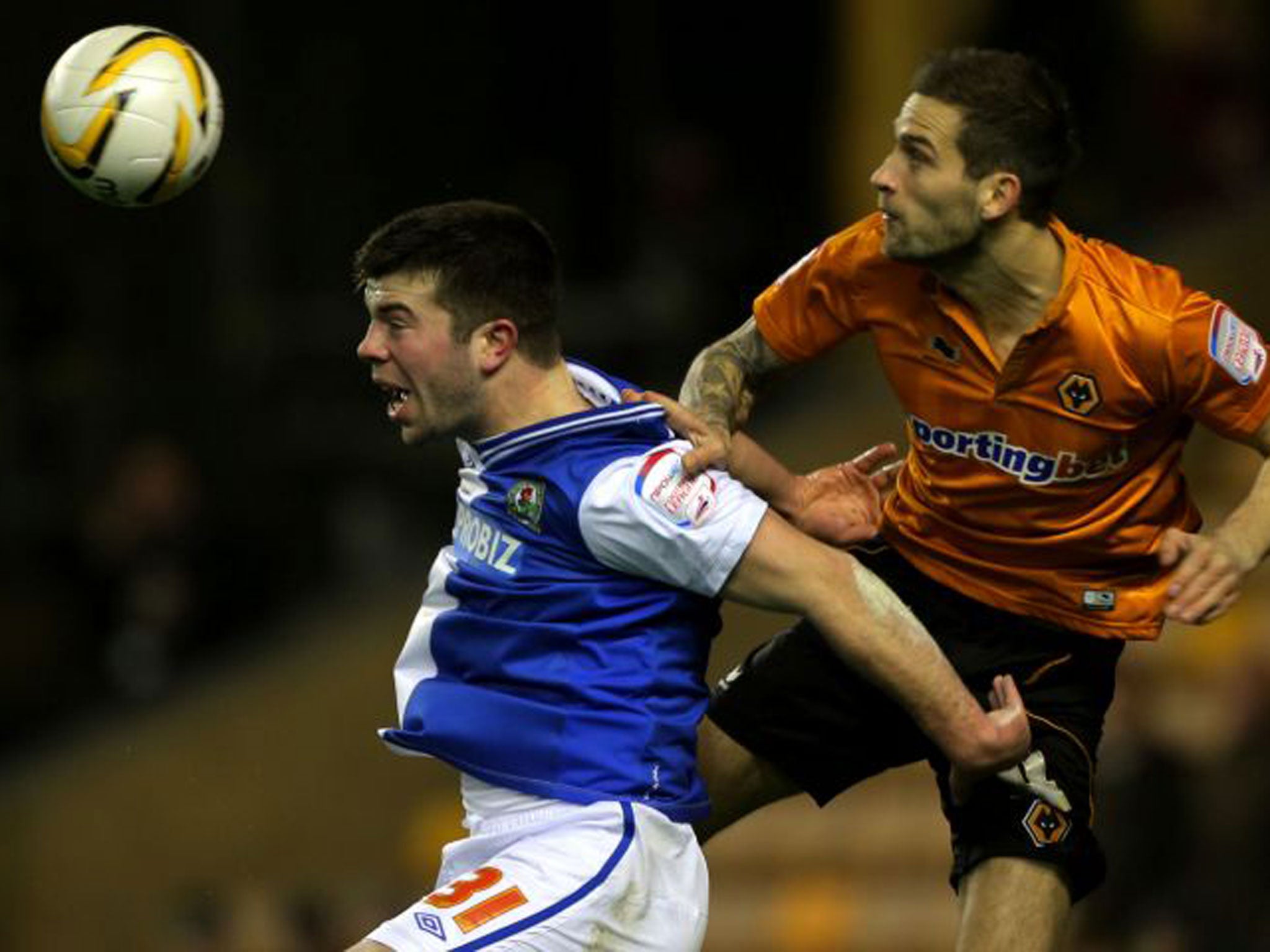 Wolves defender Roger Johnson, who scored their equaliser, outjumps Grant Hanley