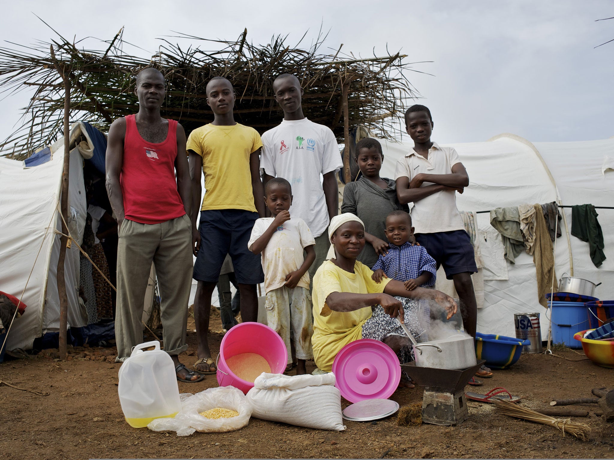 Blagnon Gnepa family, Harper, Liberia
<p>The Blagnon Gnepa family live in a temporary refugee camp for Ivorians fleeing the violence across the border, and are given essential rations such as oil and grains.</p>