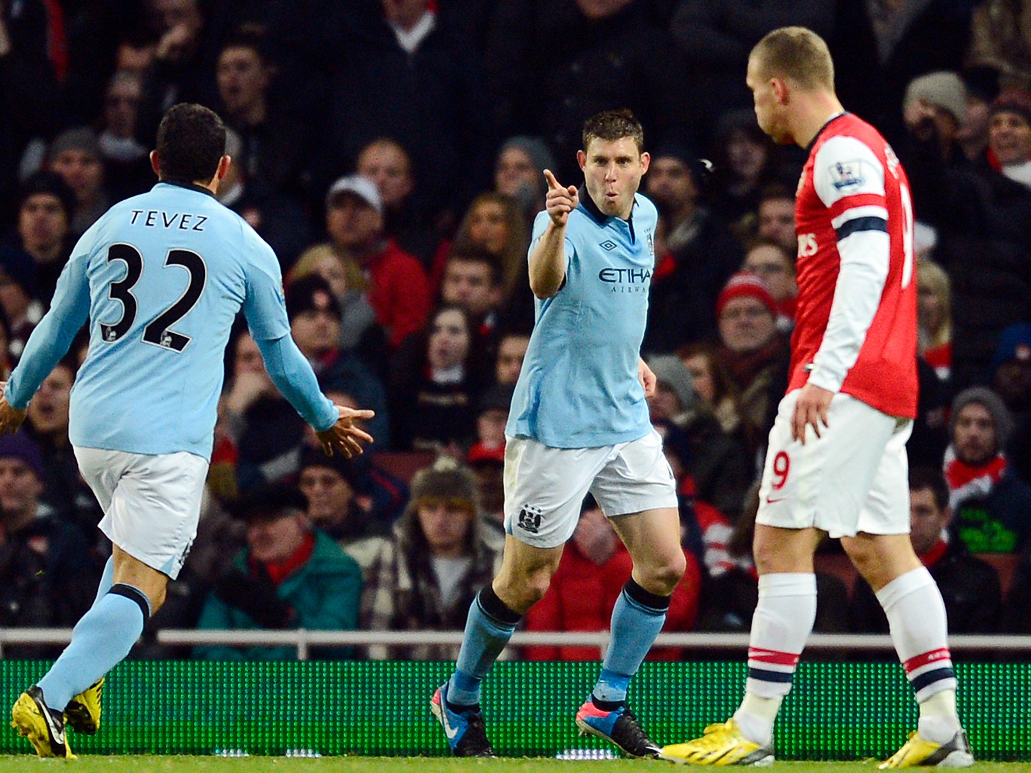 James Milner celebrates his goal with Carlos Tevez