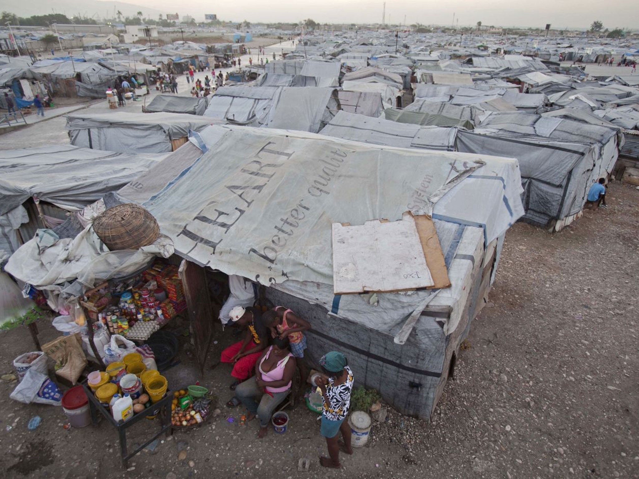 Residents at the Jean-Marie Vincent camp for displaced people yesterday