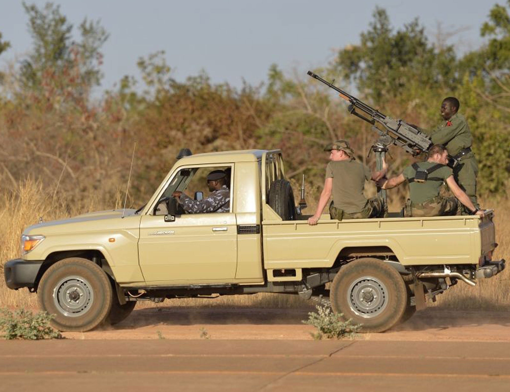 French soldiers aboard a Malian military car at a military airbase near Bamako